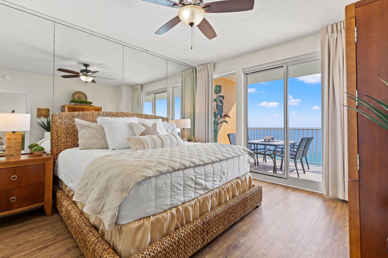 Wake up to endless ocean views from your plush bed, where gentle ceiling fan breezes and coastal sunshine greet you each morning through your private balcony doors.