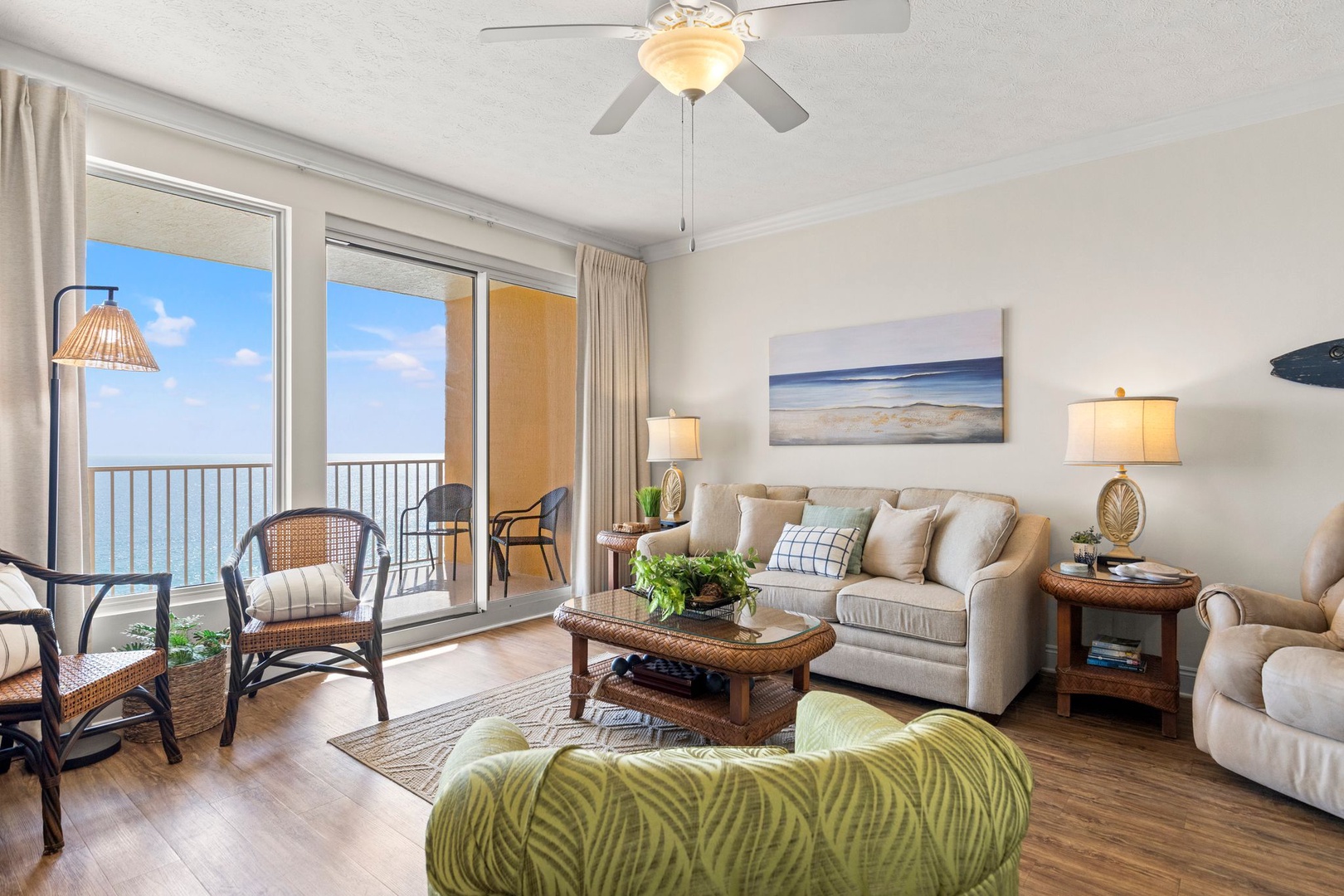 Sink into plush seating and let the ocean breeze drift through your private balcony, where coastal calm meets stylish comfort.