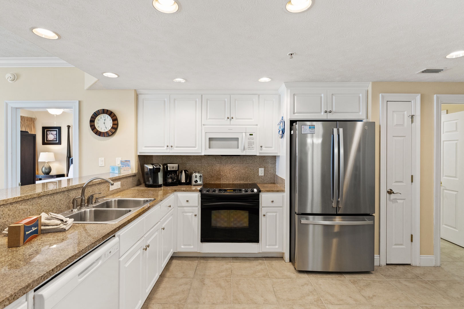 A bright, fully-equipped kitchen where you can whip up your favorite meals with stainless steel appliances, granite countertops, and plenty of prep space.