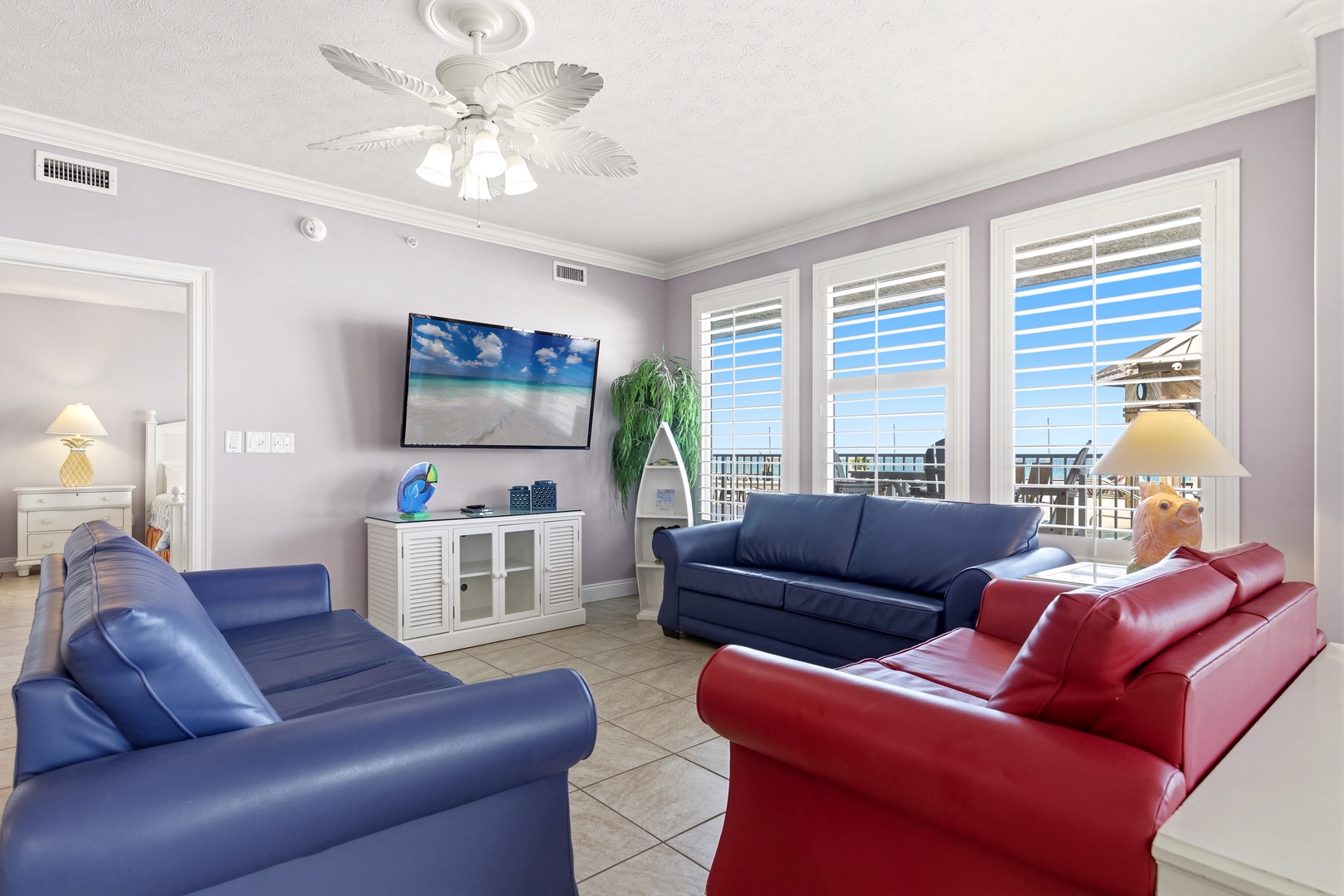 Sink into comfortable leather seating while watching your favorite shows on the large TV, with stunning coastal views through bright windows.