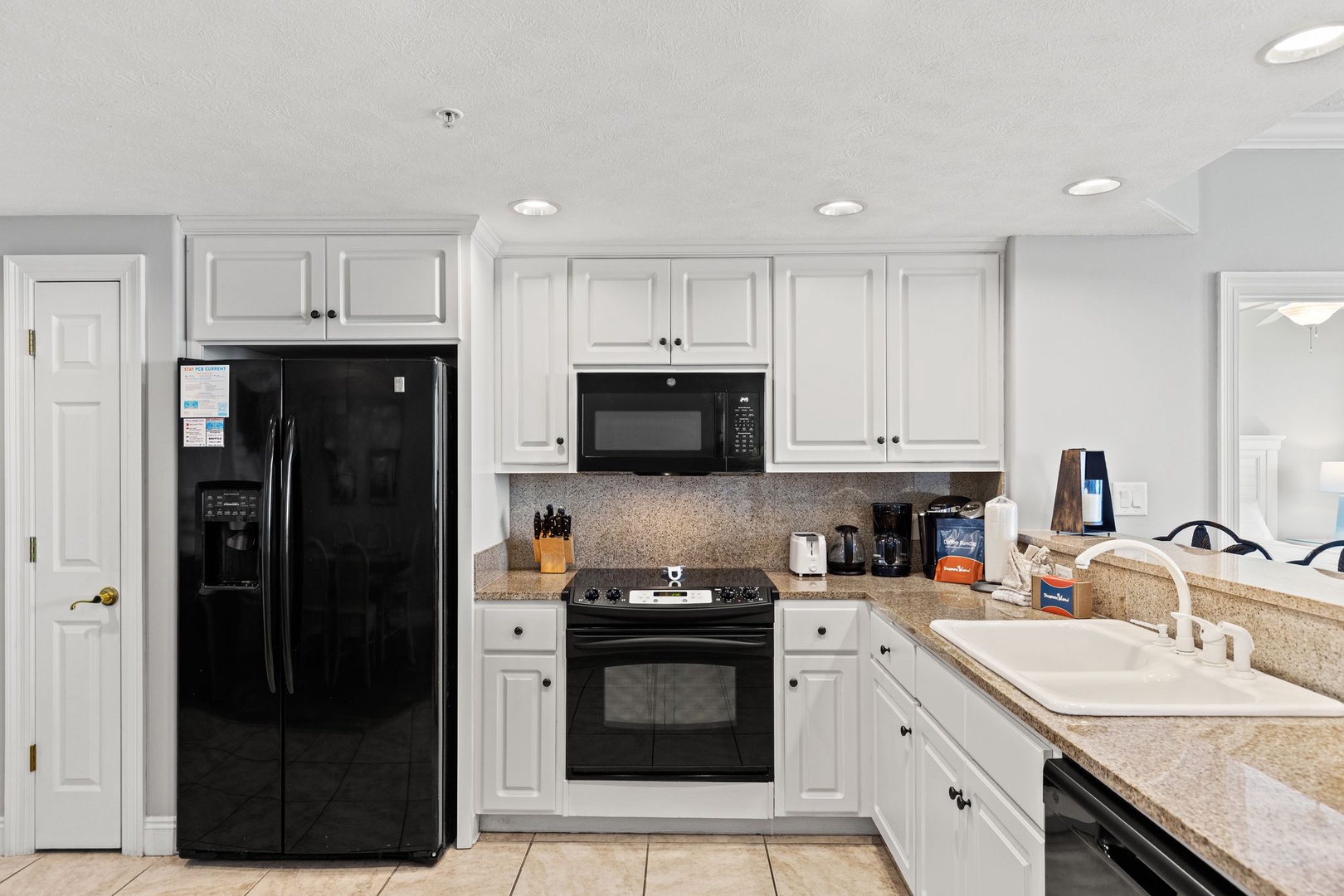 This fully equipped kitchen is ready for your culinary adventures, featuring granite countertops, modern appliances, and all the essentials to whip up your favorite meals during your stay.