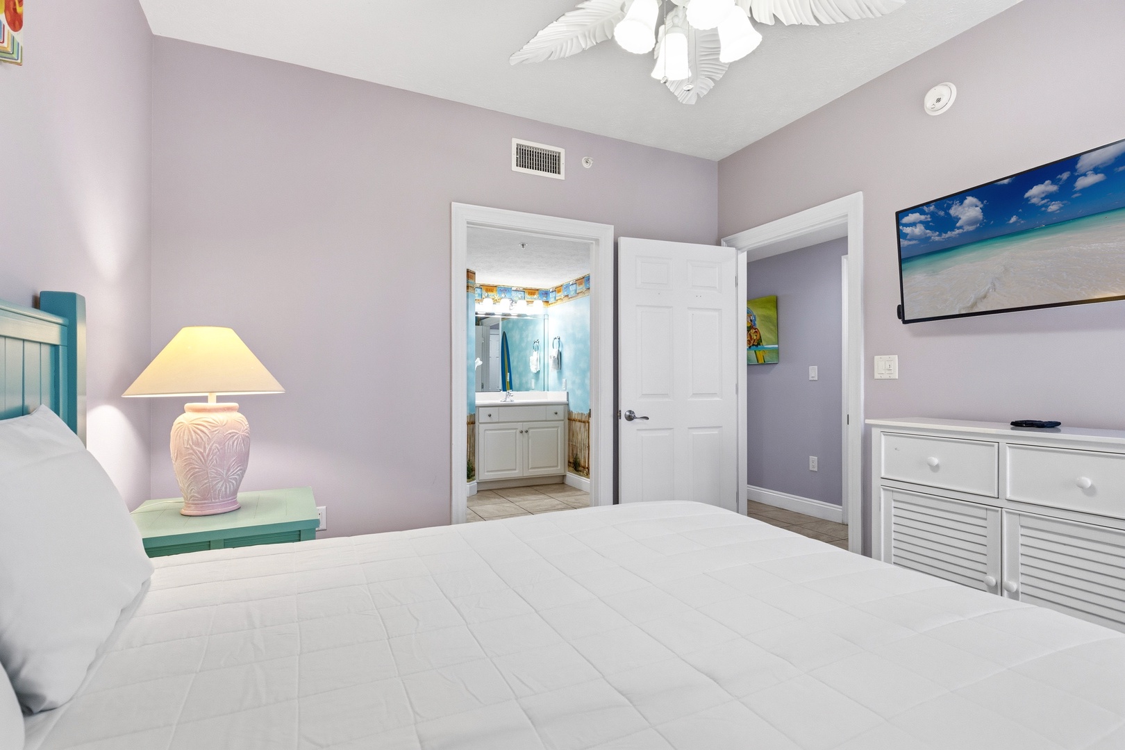 Your serene bedroom features coastal décor, crisp linens, and an en-suite bathroom—perfect for peaceful nights after beach days.