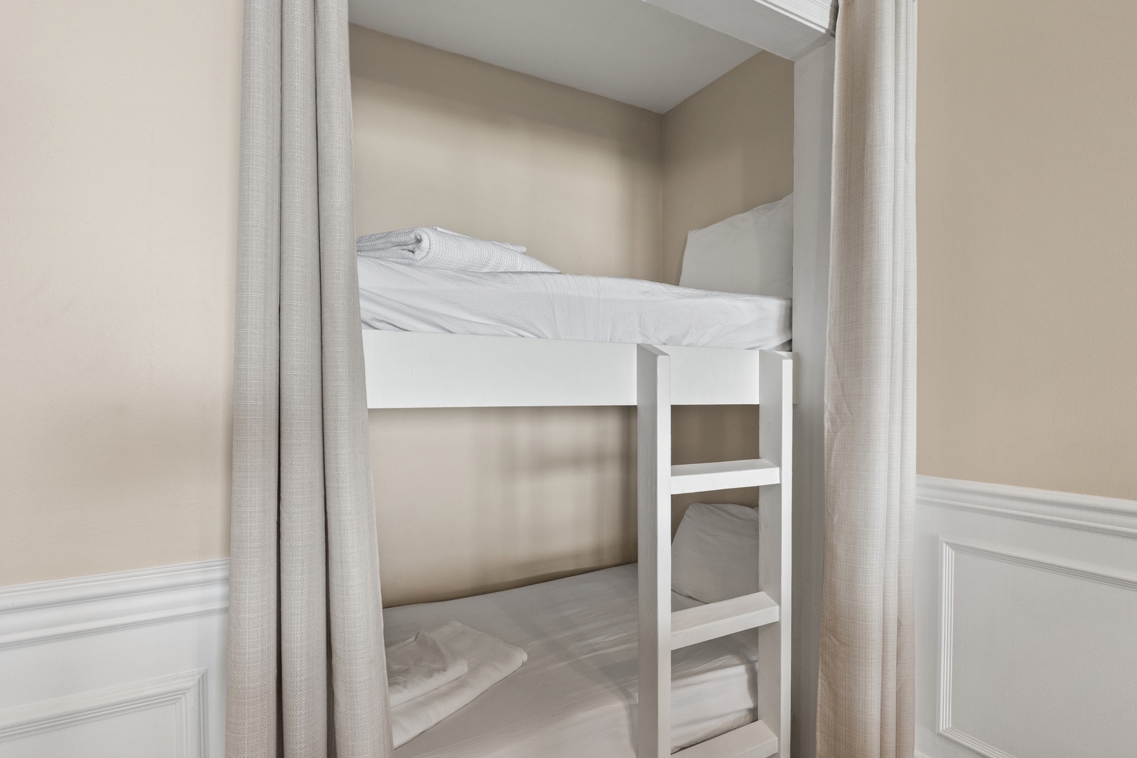 Sleep soundly in your cozy bunk nook, where crisp linens and privacy curtains create the perfect retreat.