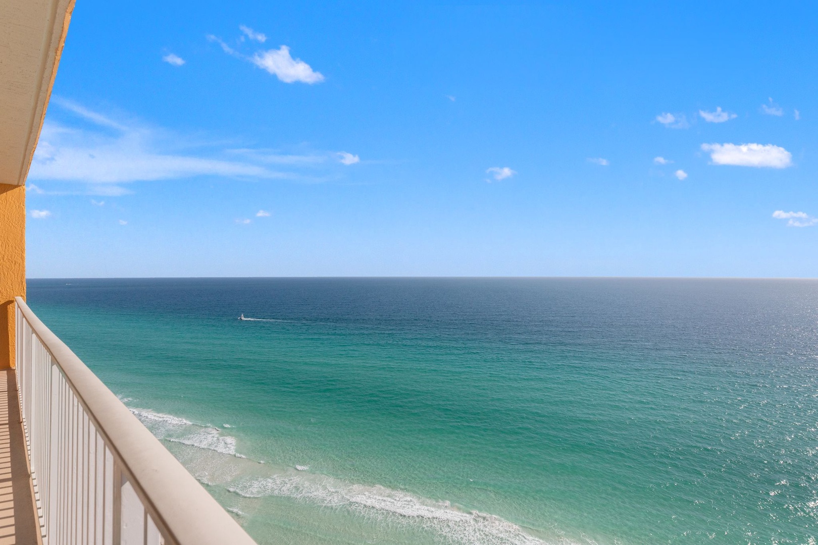 Panoramic oceanfront view showcasing turquoise waters and pristine coastline from this elevated beachside location.