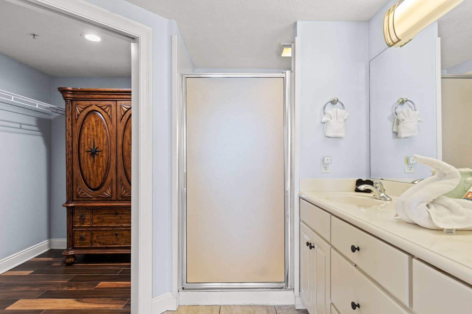 Step into your fresh, spa-like bathroom with a frosted privacy window, crisp towels awaiting, and soft lighting that makes every morning feel rejuvenating.