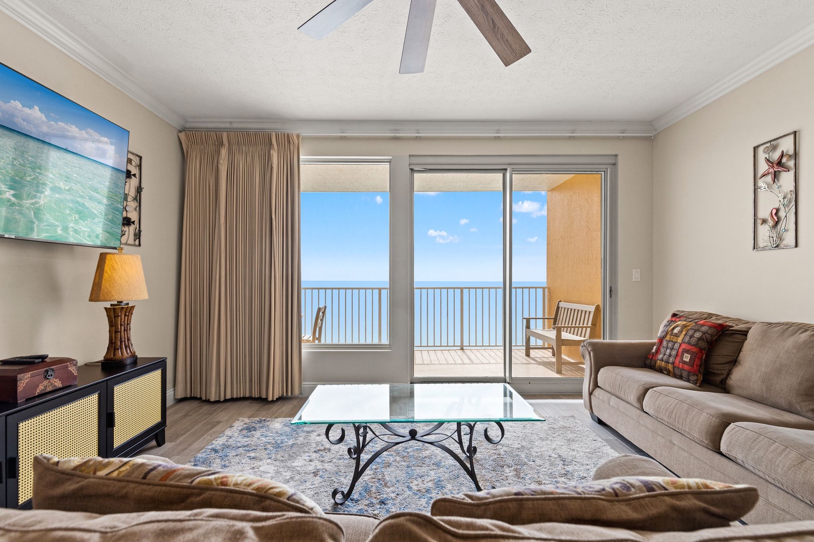 Relax in your oceanfront living room where panoramic sea views create the perfect backdrop for unwinding after beach days.