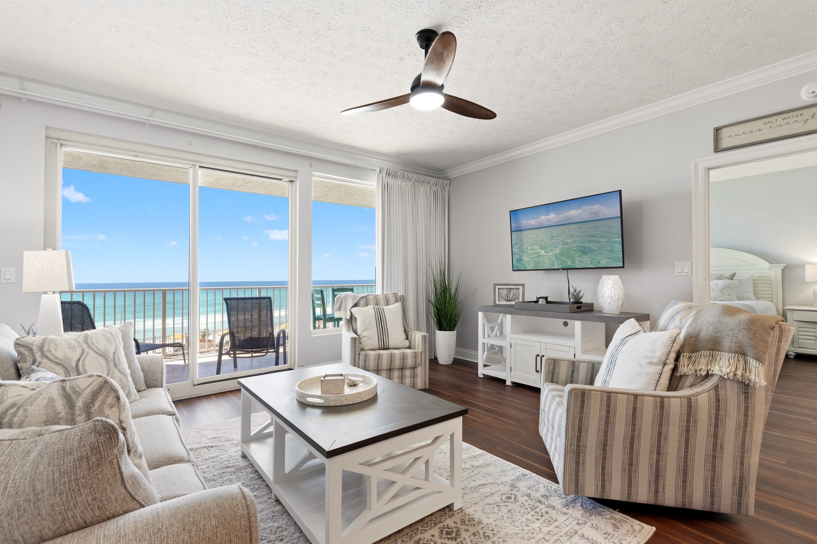 Relax in coastal elegance as you unwind in your spacious living room, where floor-to-ceiling windows frame endless ocean views.