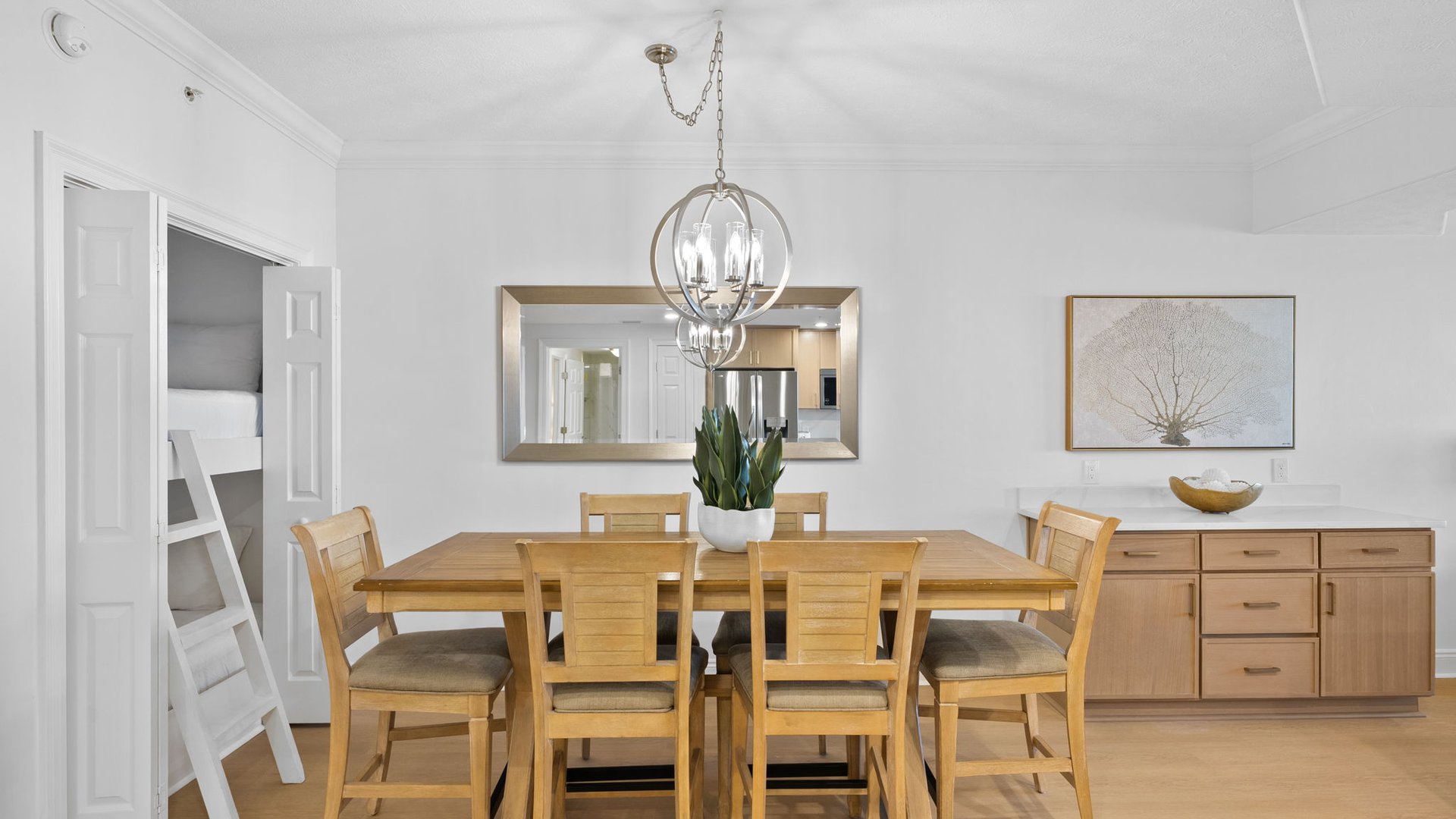 Your elegant dining space features warm wood tones and modern lighting, perfect for memorable meals together.