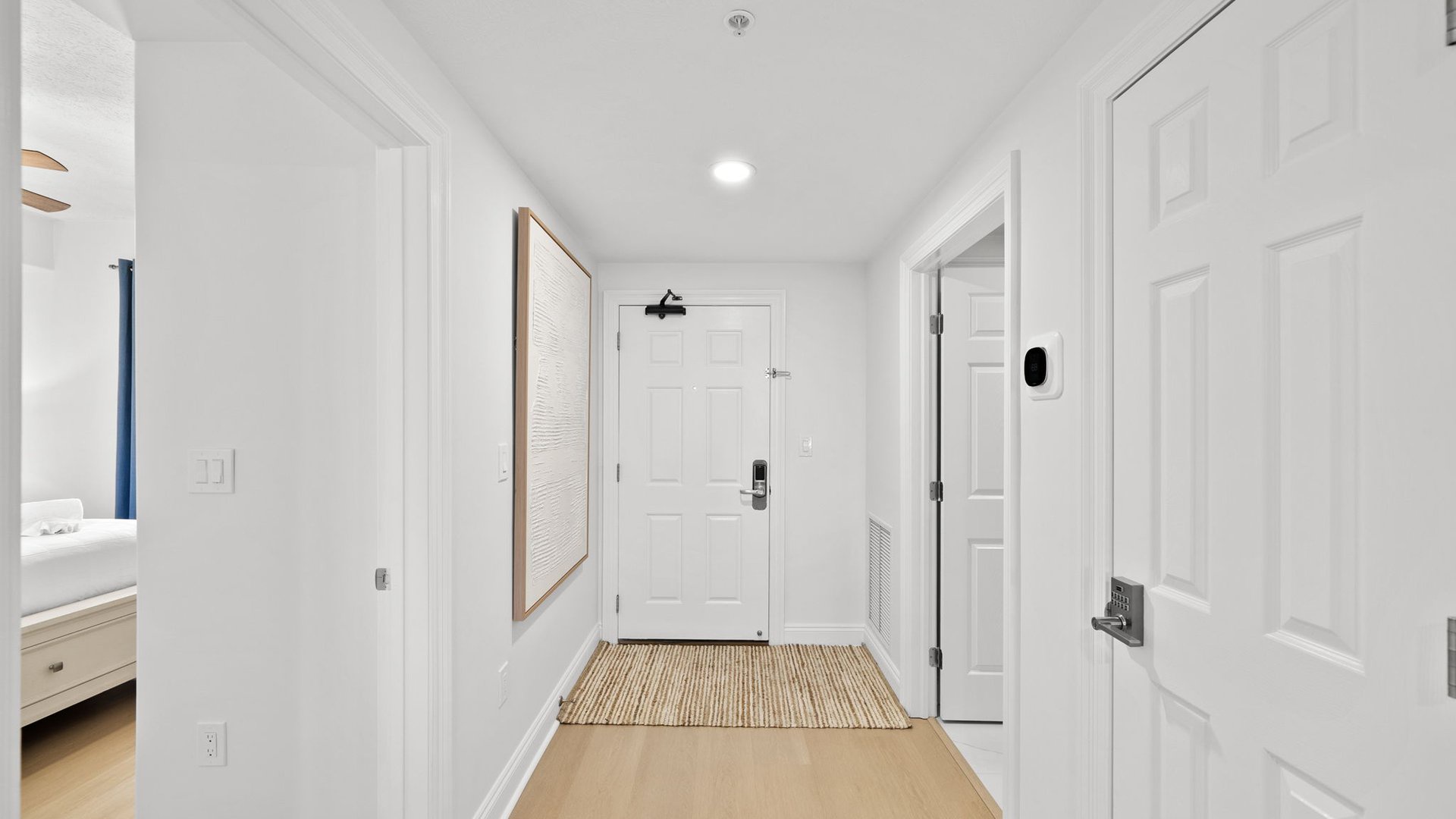 Step into your bright, welcoming entryway with warm wood floors and coastal charm that sets the tone for your stay.