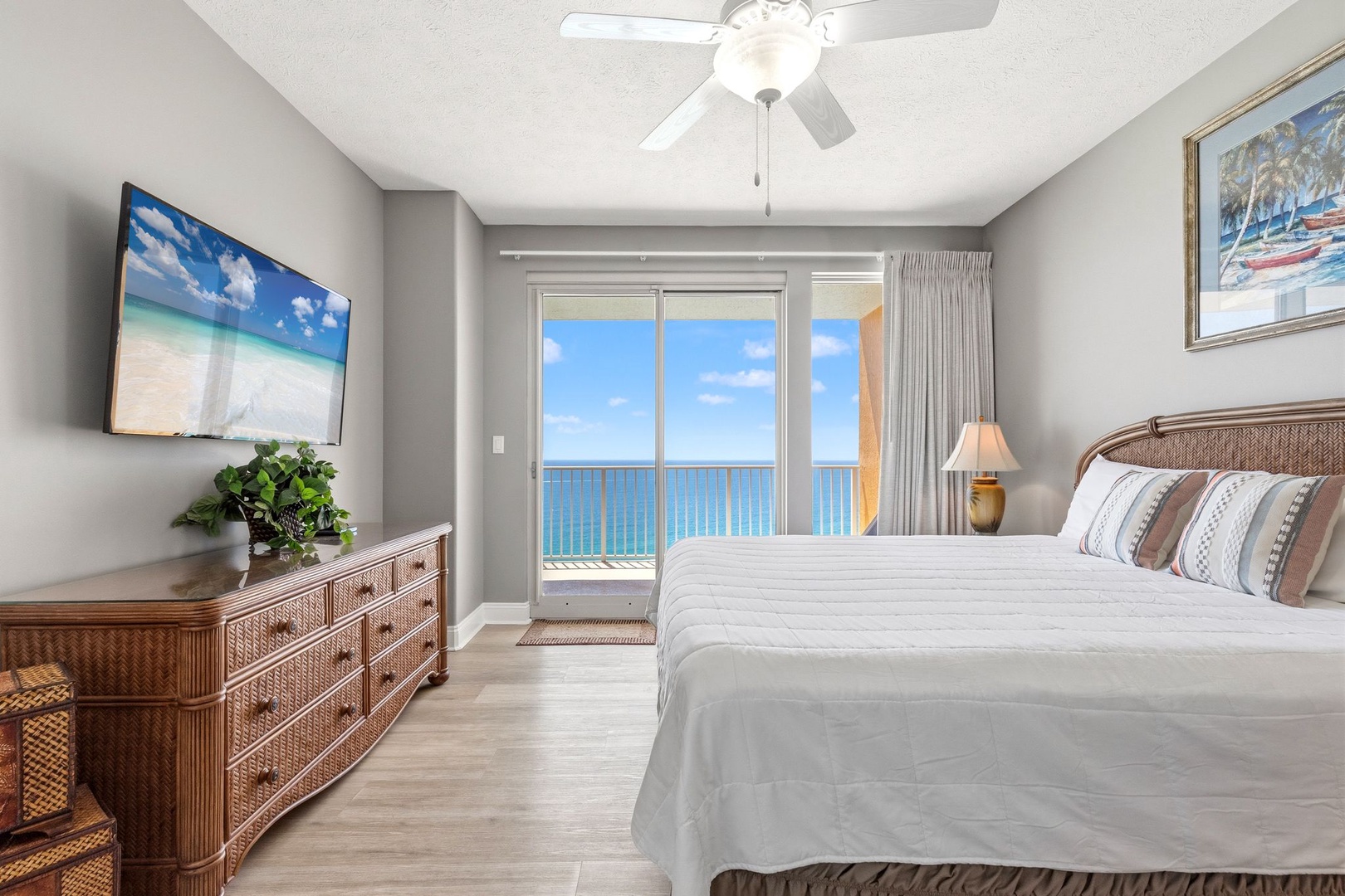 Wake to breathtaking ocean views through your private balcony doors, where turquoise waters stretch endlessly beyond.