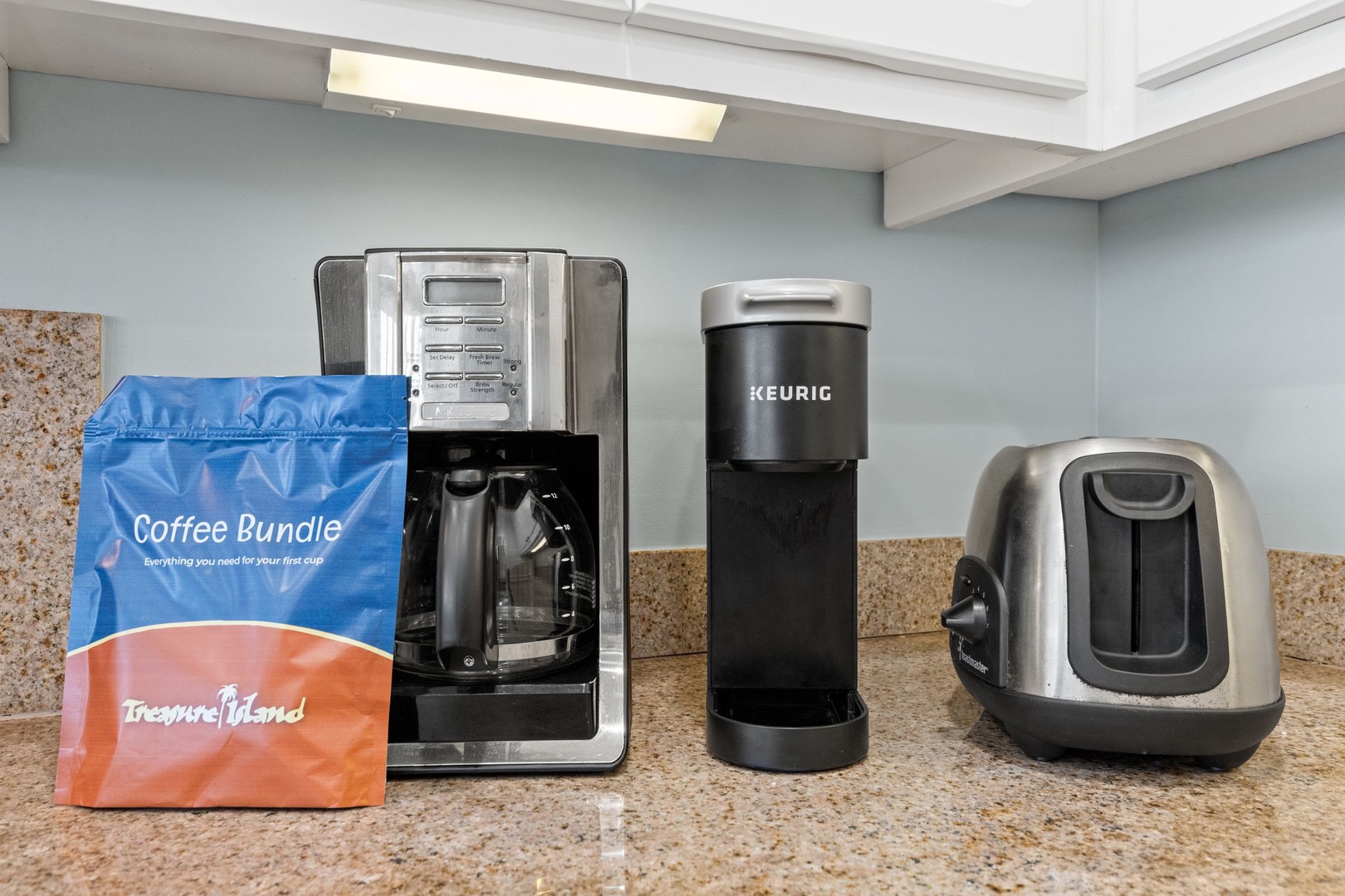Brew your perfect morning cup with a full coffee station featuring a Keurig, traditional coffee maker, and complimentary coffee bundle to start your day right.