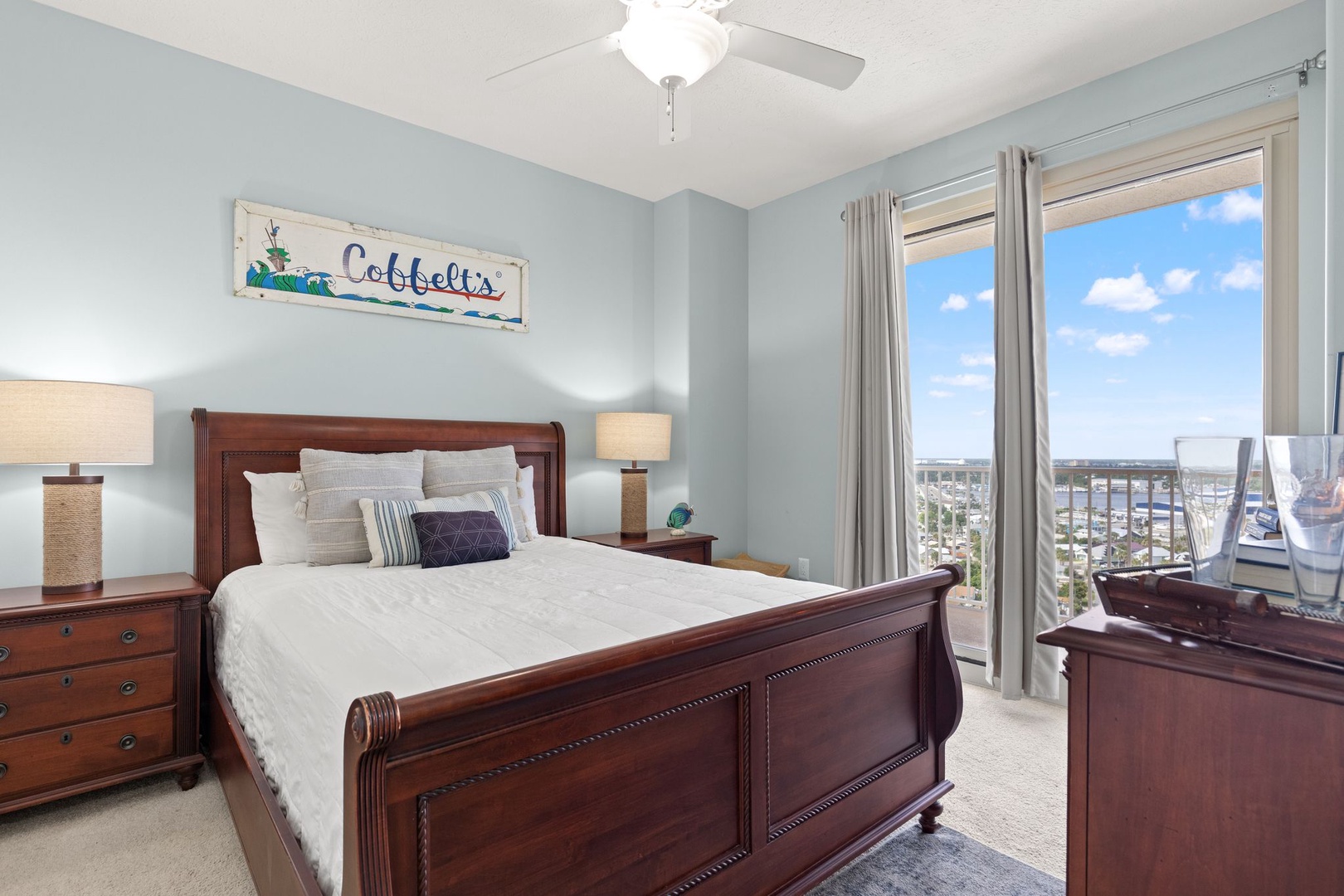 Wake up to crisp, cool comfort and stunning coastal views from your serene bedroom retreat. The soothing blue walls and plush bedding invite relaxation after a day of adventure.