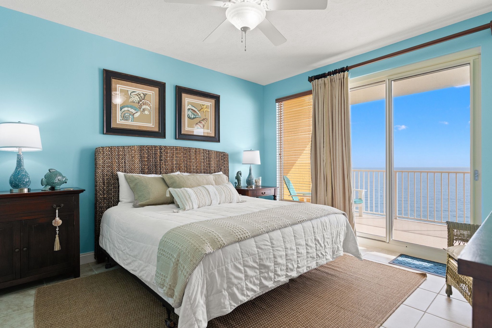 Wake up to stunning ocean views from your coastal bedroom. The inviting bed and private balcony access make this your perfect seaside sanctuary.