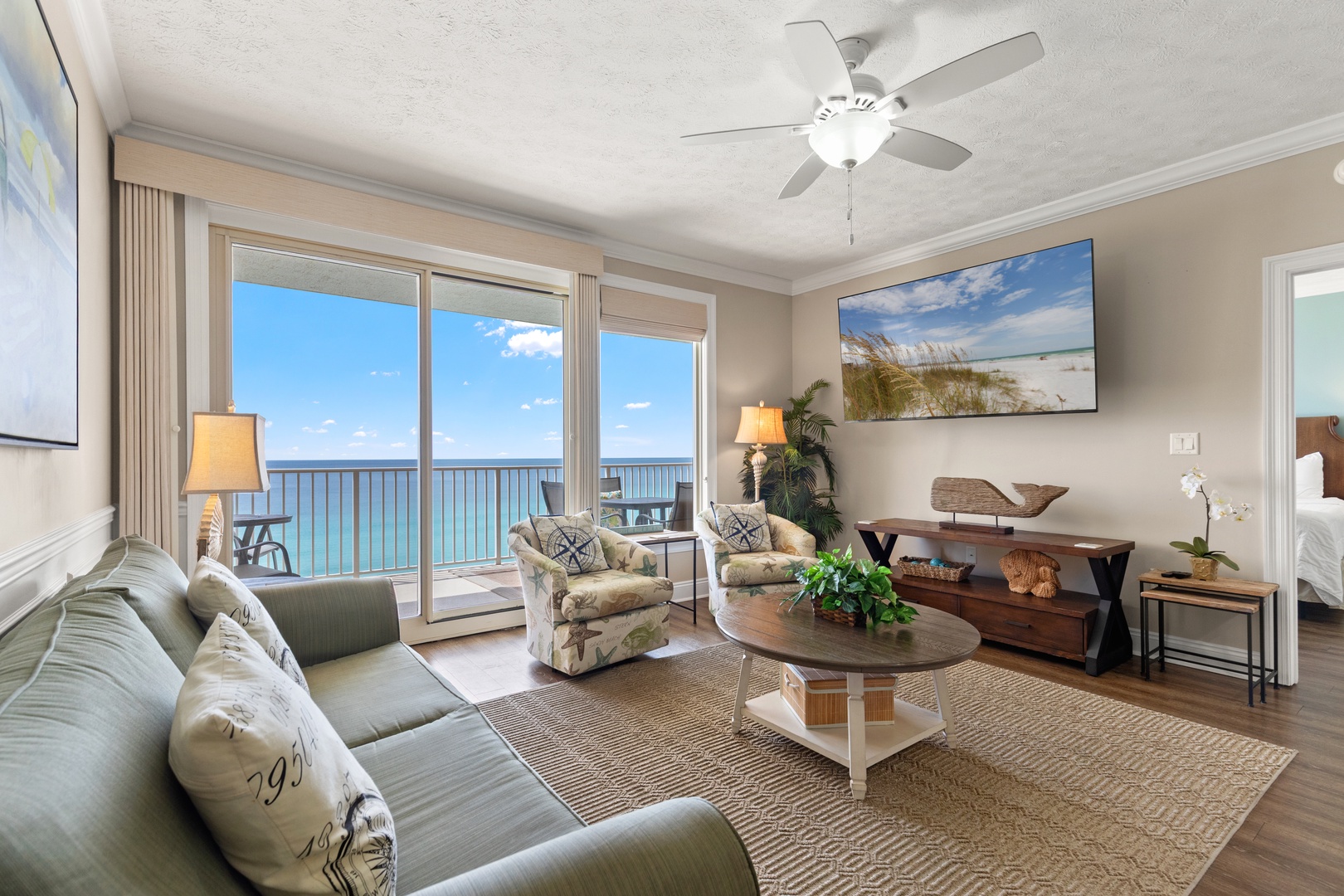 Unwind in your spacious oceanfront living room with panoramic sea views through floor-to-ceiling windows.