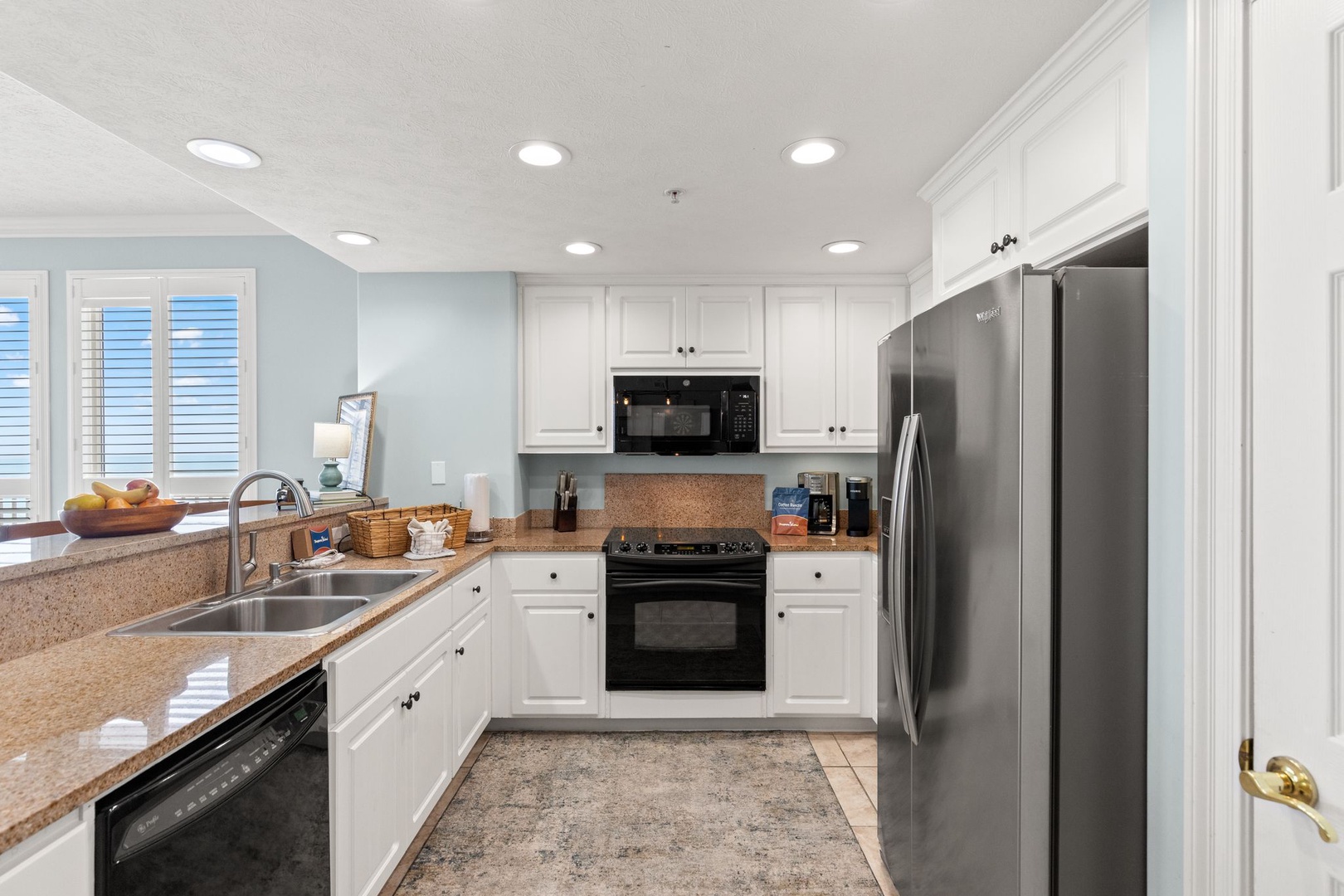 Your fully equipped kitchen has everything you need—granite counters, stainless-steel appliances, and bright natural light. Whip up morning coffee or family meals in this inviting, spacious space.