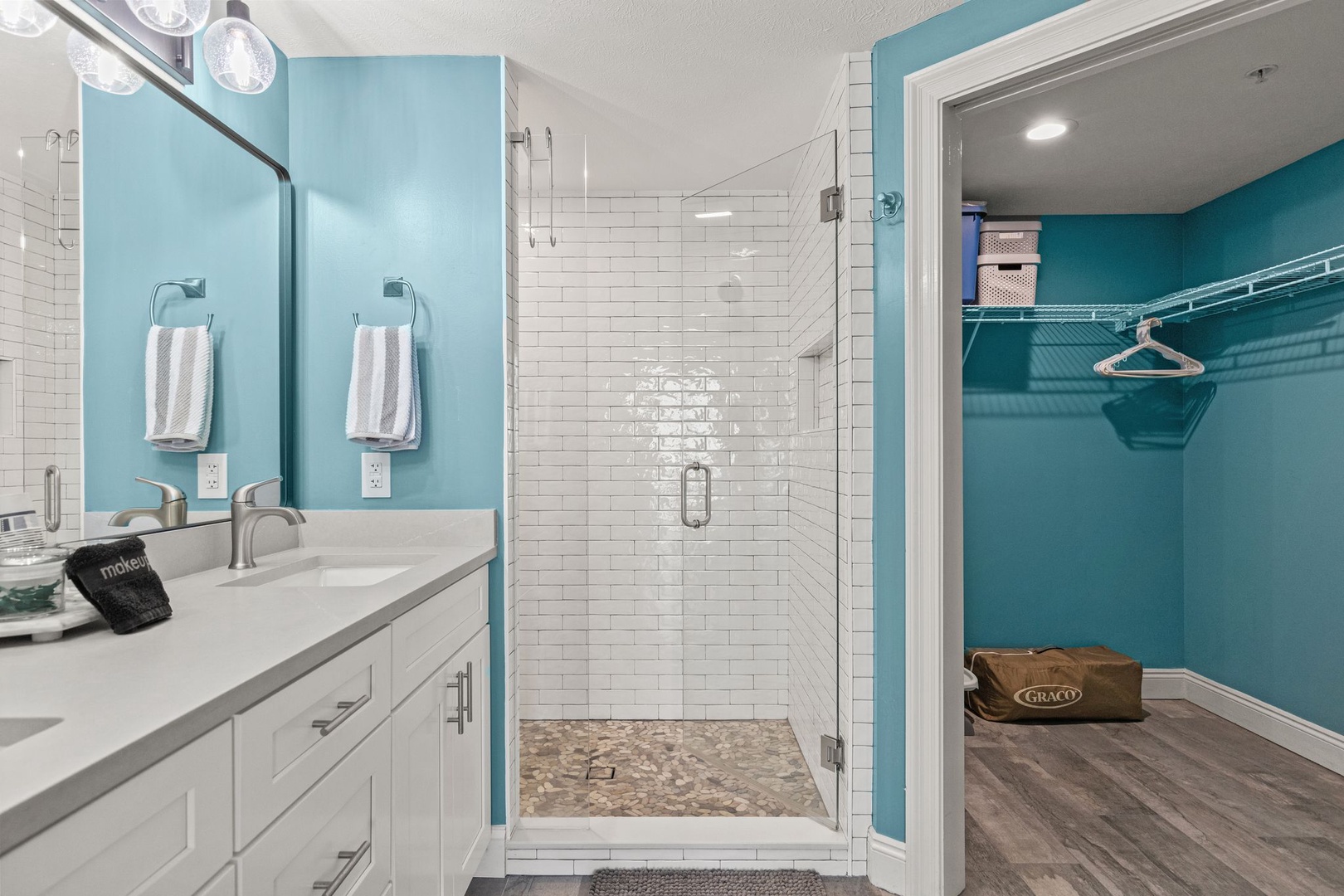 Step into your private spa with a pristine walk-in shower featuring classic subway tile, and enjoy the convenience of your own walk-in closet for effortless unpacking.
