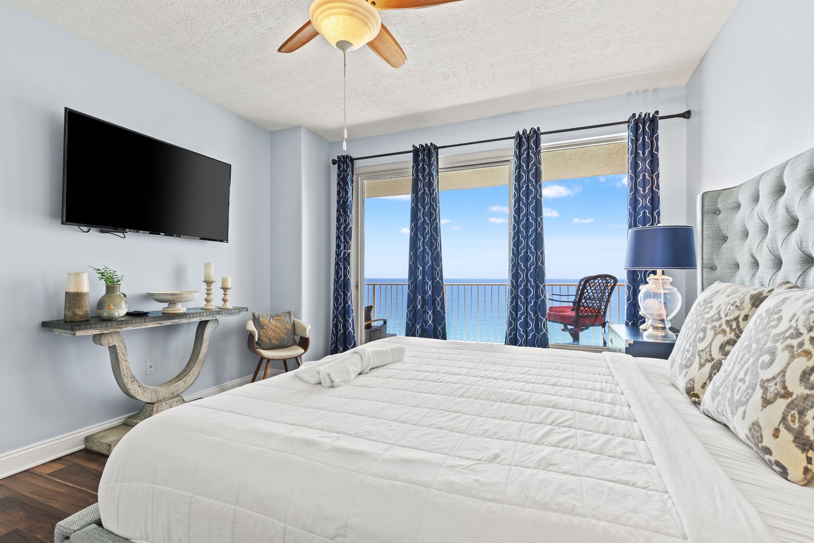 Wake up to breathtaking ocean views framed by your private balcony, where calming blue hues and coastal breezes set the tone for your perfect beach retreat.