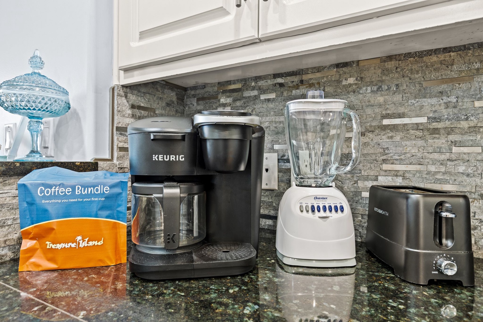 Your morning starts easy with a Keurig coffee maker, blender, and toaster—everything you need for a fresh, homemade breakfast in your fully equipped kitchen.