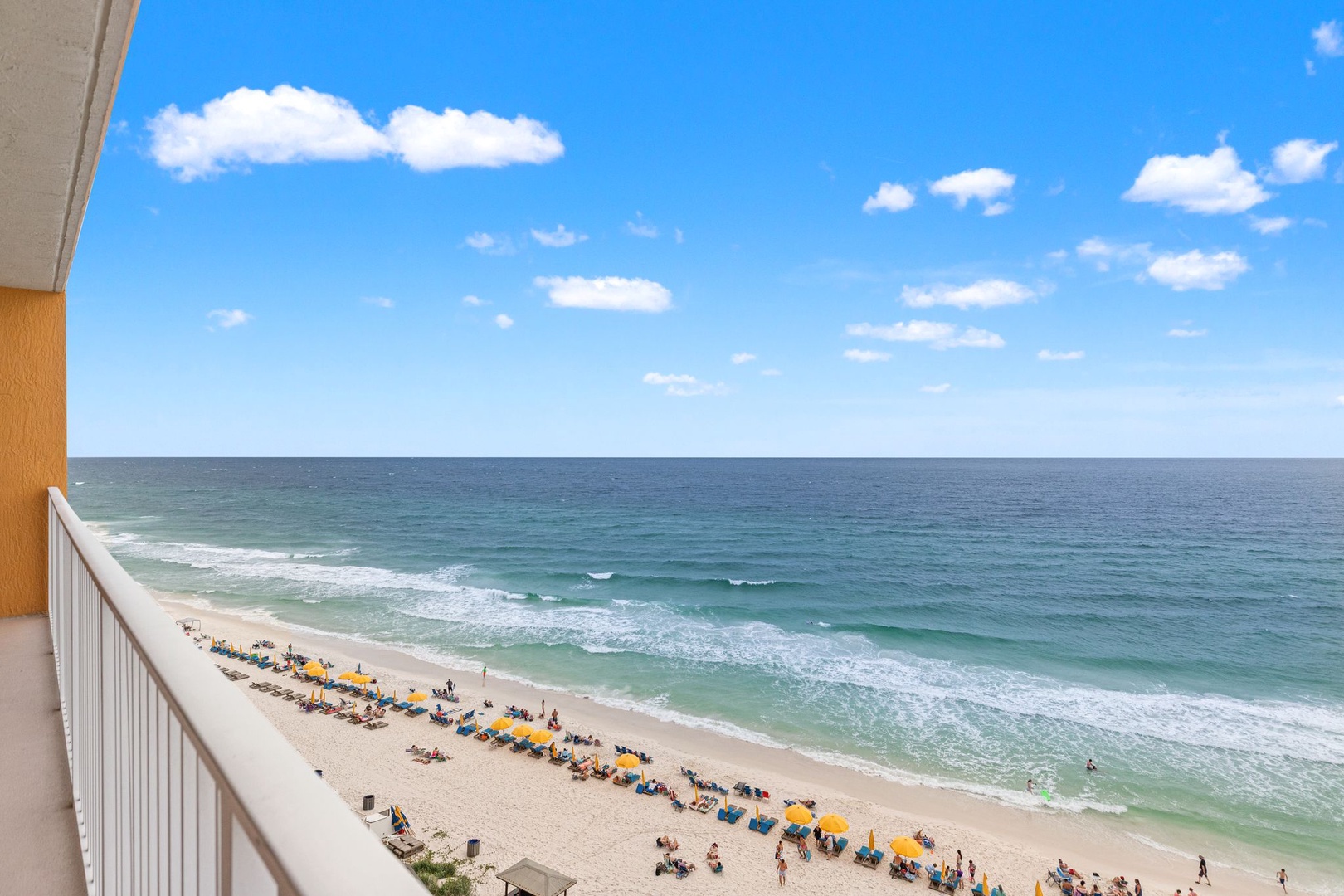 Breathtaking beachfront panorama showcasing pristine turquoise waters meeting soft sandy shores, perfect for soaking in endless ocean views from your private balcony retreat.