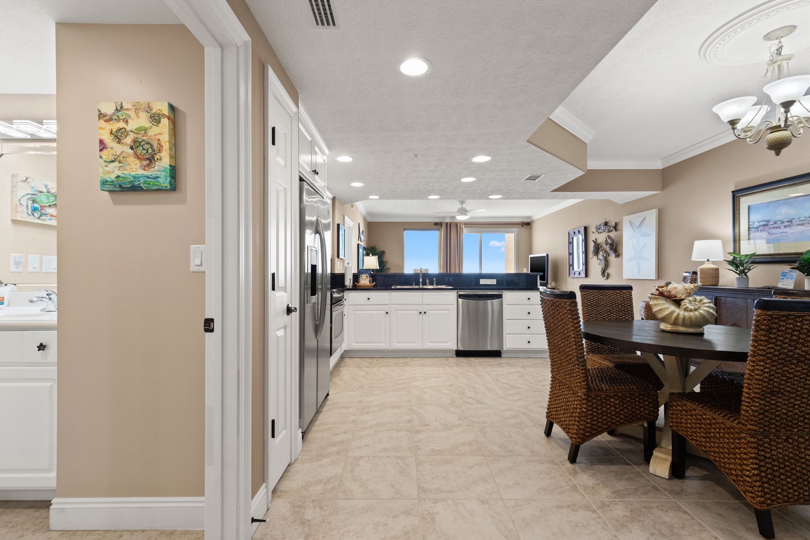 Your spacious open-plan kitchen and dining area invites you to gather, cook, and share meals with natural light streaming through the windows.