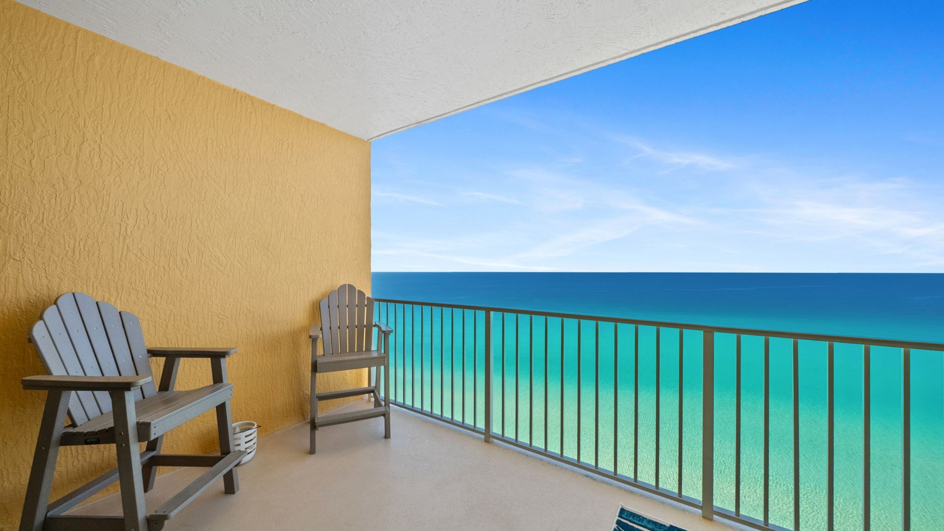 Sip your morning coffee on this oceanfront balcony with stunning turquoise waters stretching endlessly before you.