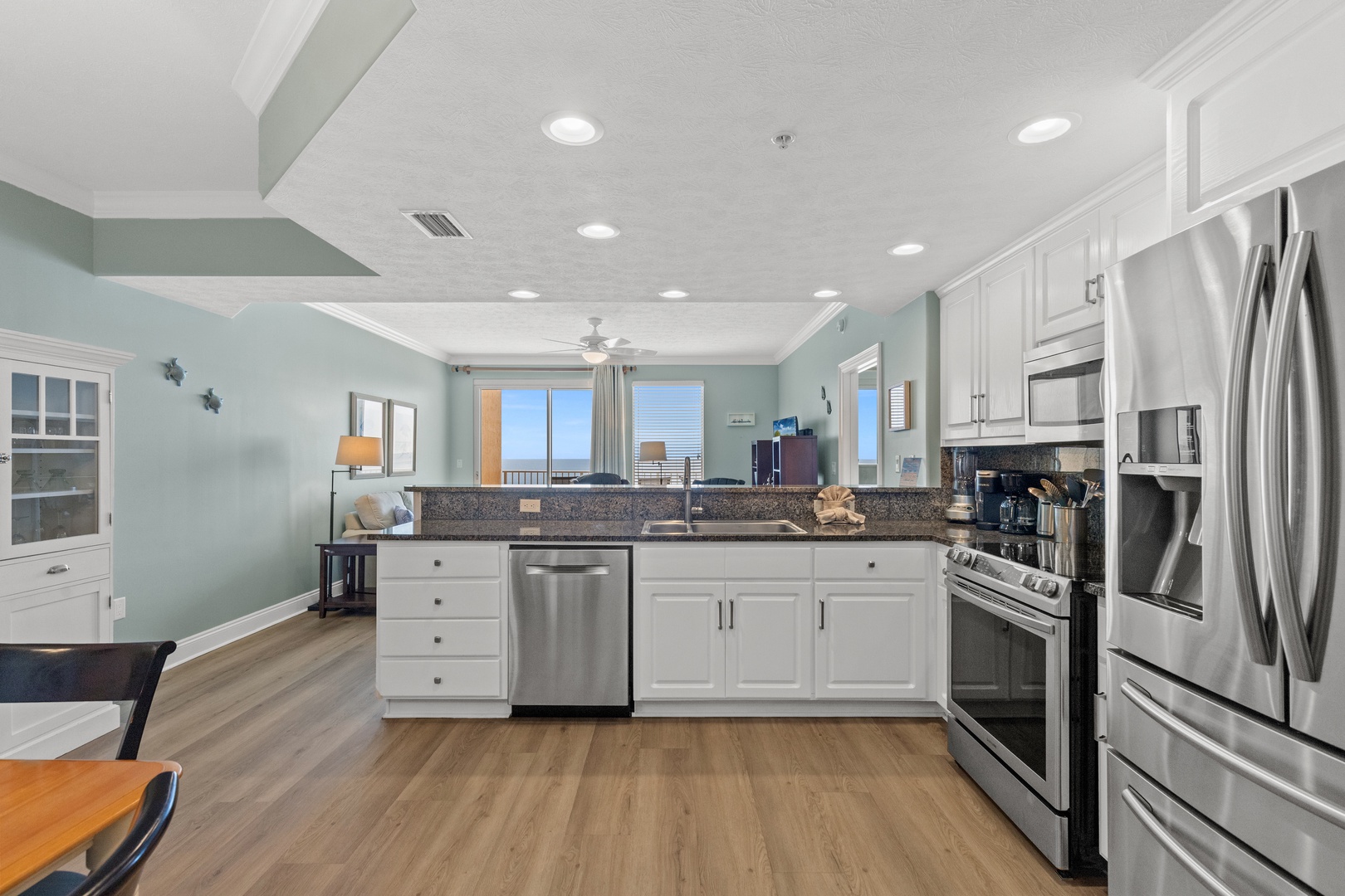Your spacious chef's kitchen awaits with stainless steel appliances, granite countertops, and beautiful city views to inspire your culinary adventures.