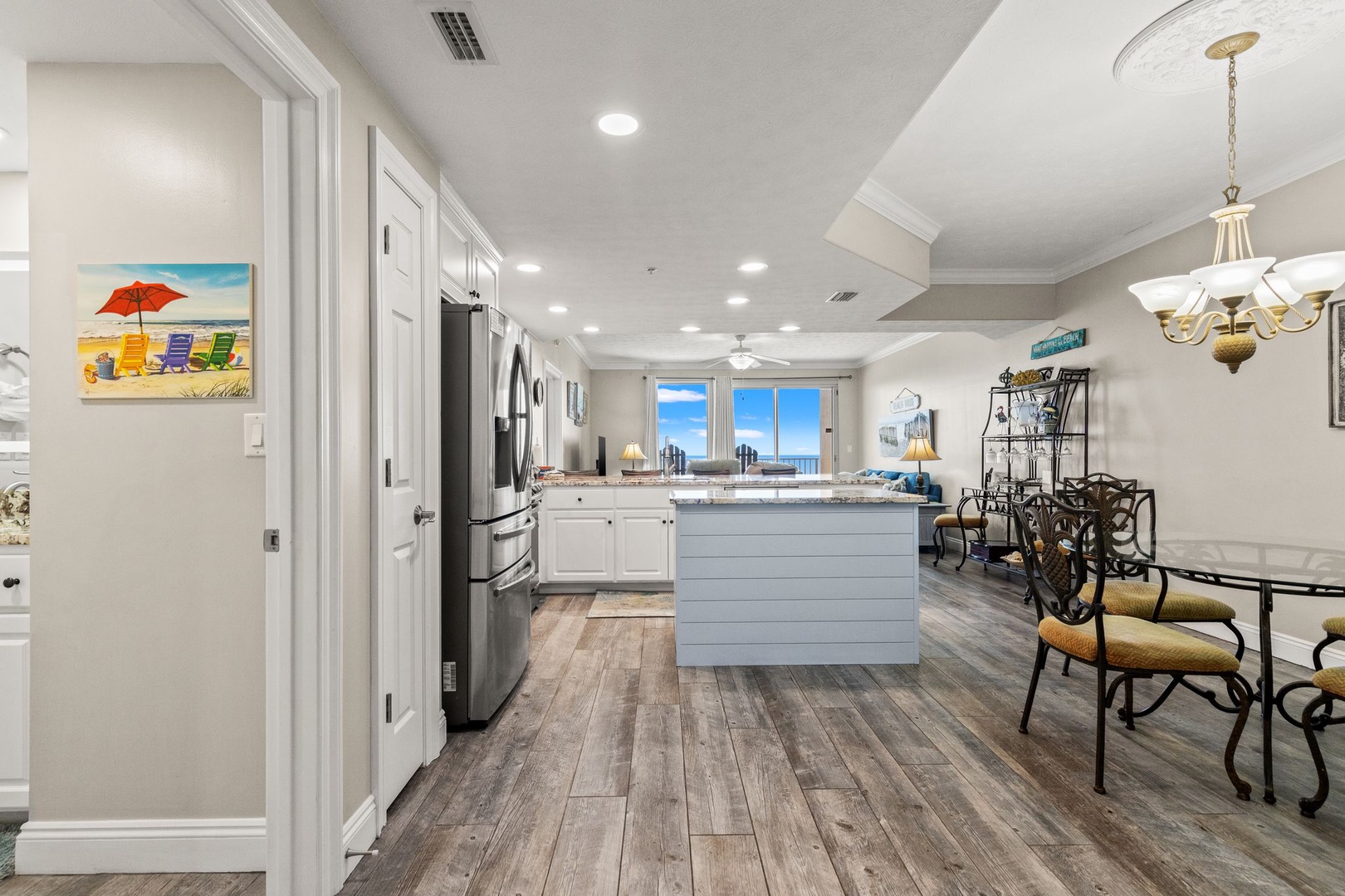 Picture yourself preparing meals in this bright, open kitchen with stunning sea views just beyond the windows. The island invites conversation while you cook, and the dining table is perfectly positioned for sunset dinners.