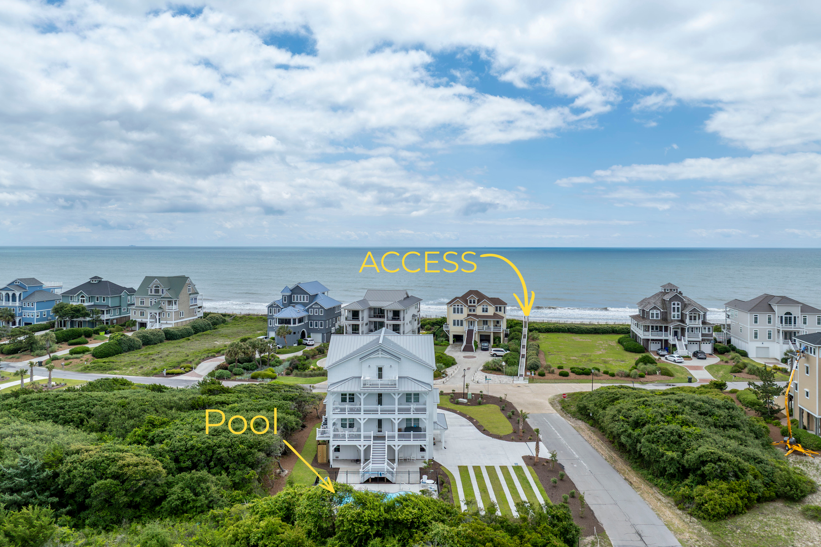 Stunning beachfront property with direct ocean access and private pool, nestled in a beautifully landscaped coastal neighborhood with breathtaking sea views.