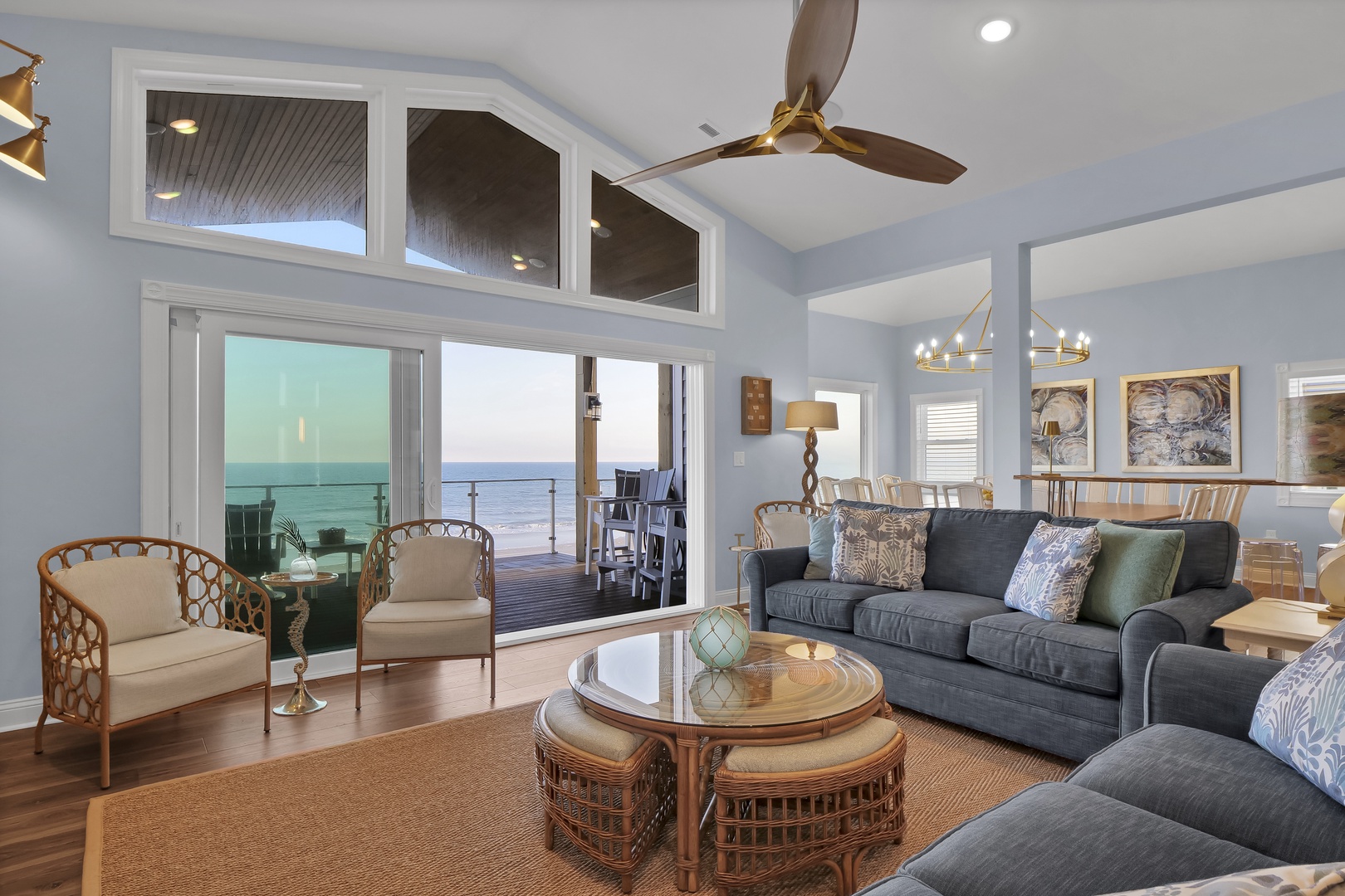 Sink into plush seating and let your gaze drift to the sparkling ocean just beyond your door. This coastal living room invites you to unwind in style.