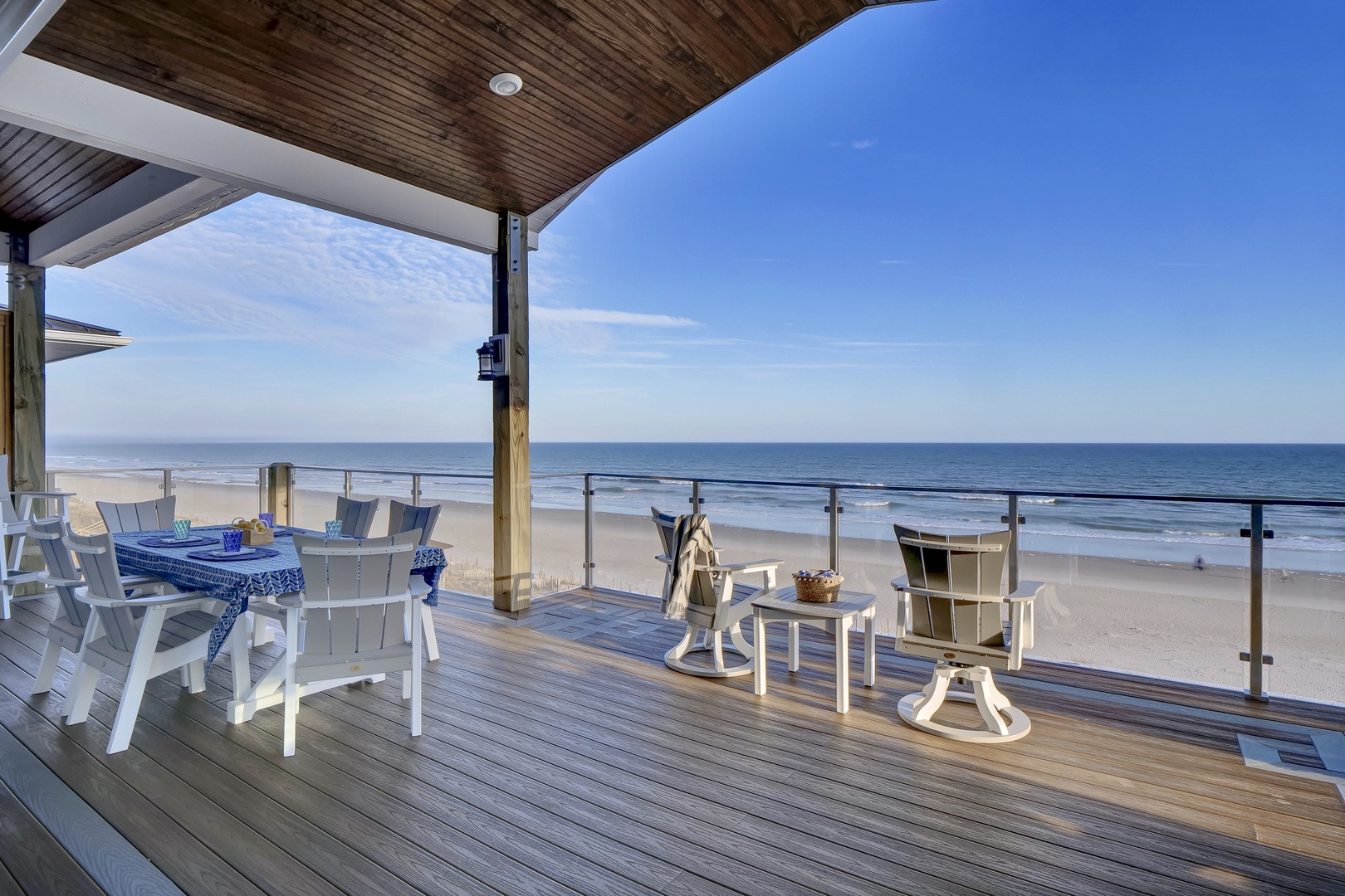 Step onto your private deck where ocean waves meet endless blue skies, inviting you to unwind in beachfront comfort with morning coffee or sunset conversations just steps from the sand.