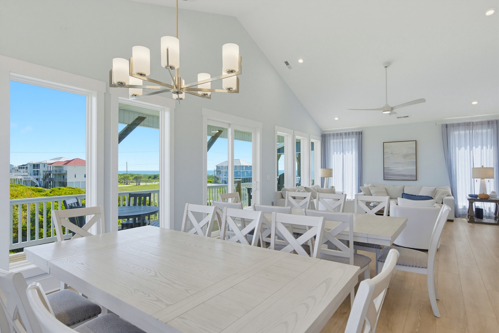 Step into your bright coastal retreat where vaulted ceilings and open spaces welcome you home. Gather around the spacious dining table with loved ones while gentle sea breezes drift through open doors from your private deck.