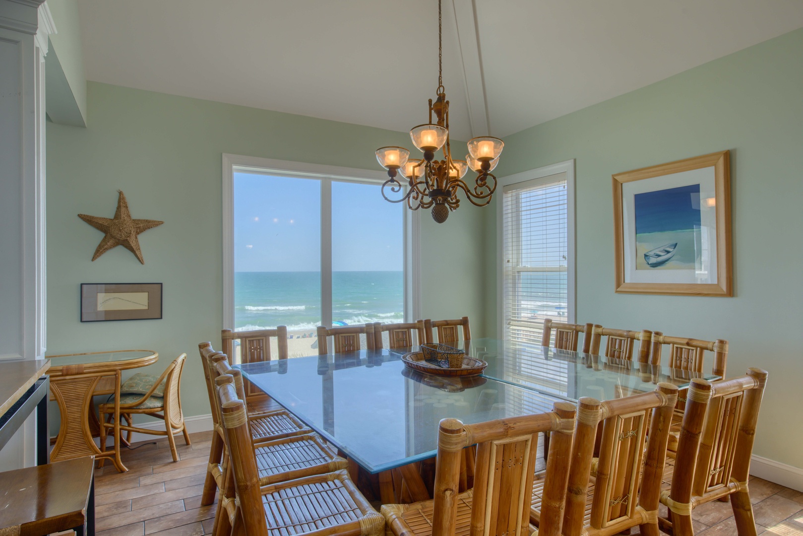 Step into this bright dining space where you can savor every meal with stunning ocean views through expansive windows that frame the waves rolling in. Gather around the generous table with family and friends for memorable coastal dining.