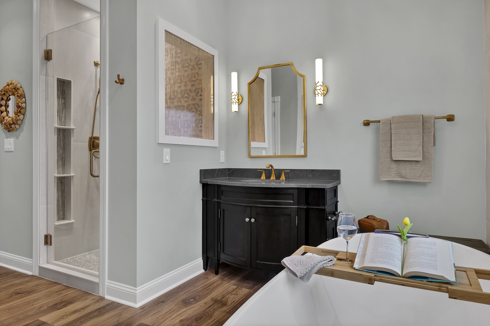Sink into your own spa-like oasis, where elegant gold fixtures, soft lighting, and a luxurious soaking tub invite you to unwind completely after a day of exploring.