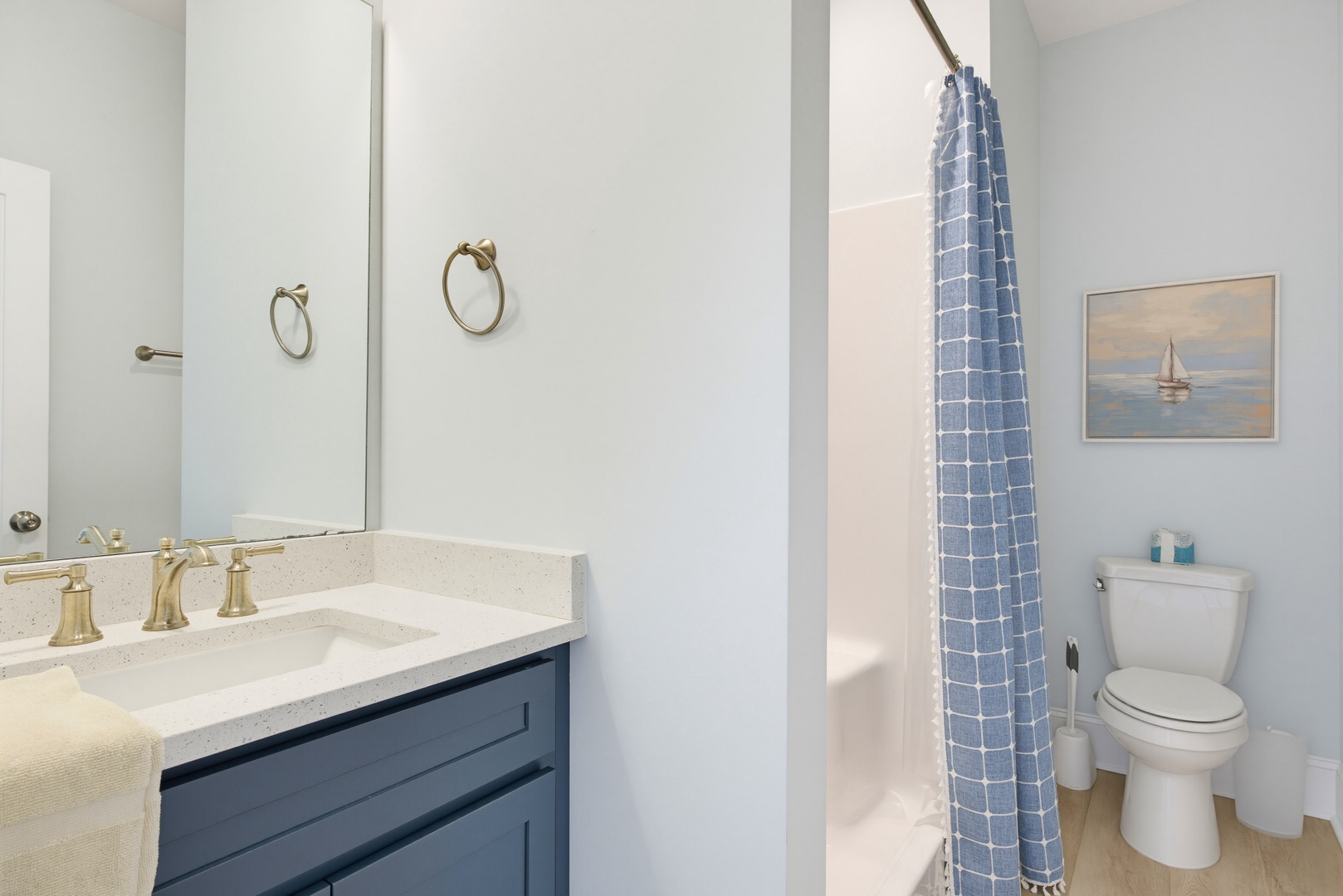 Step into your serene private bathroom, featuring a spacious walk-in shower and elegant fixtures that create a peaceful retreat after your beach adventures.