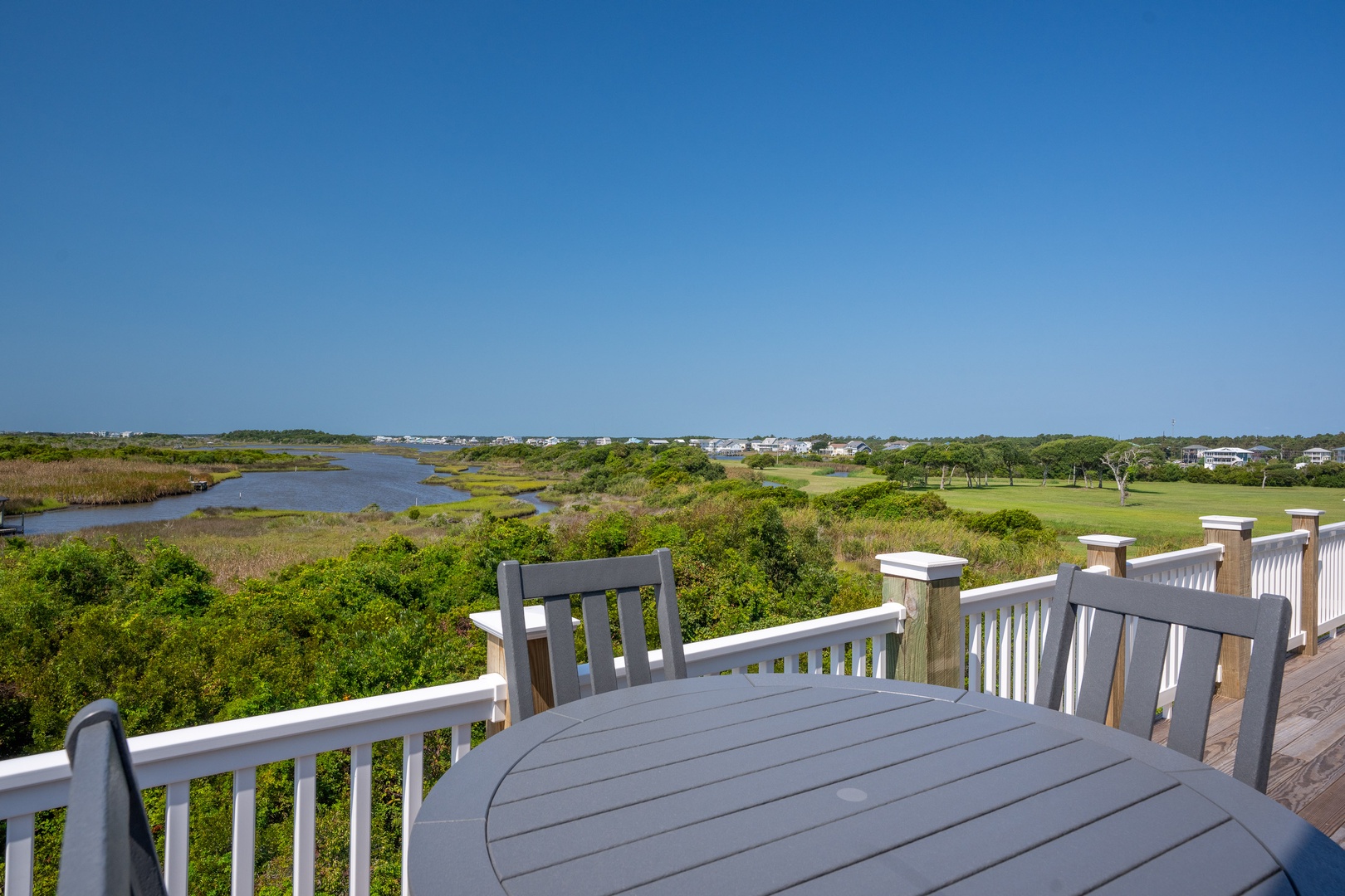 Soak in sweeping views of coastal marshlands and waterways from your private deck—a tranquil setting perfect for morning coffee or evening relaxation.
