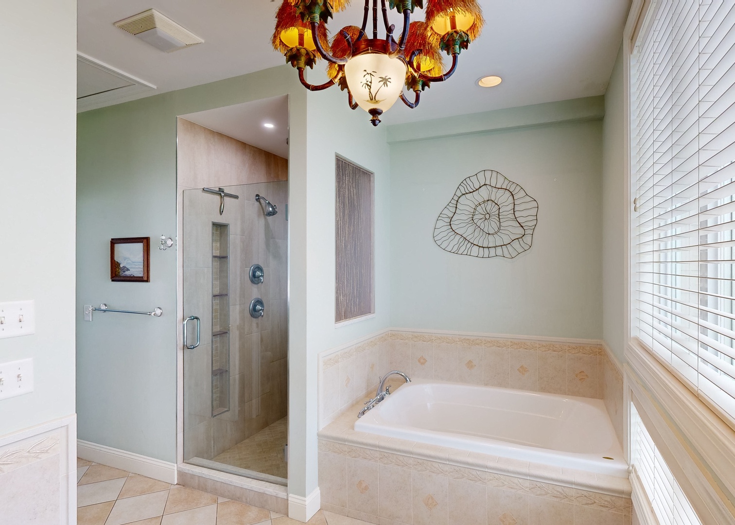 Sink into your private soaking tub after a day of adventure, or refresh in the spacious walk-in shower. This bright, coastal-inspired bathroom blends comfort and style for your perfect retreat.