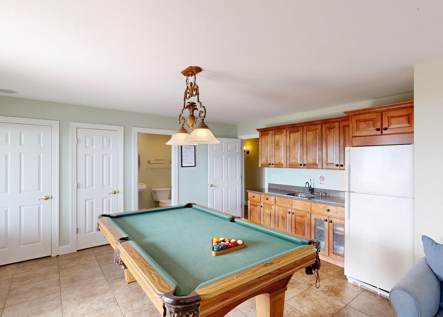 Your own game room awaits with a full-size billiard table and convenient kitchenette—perfect for friendly matches and easy refreshments without missing a moment of the fun.