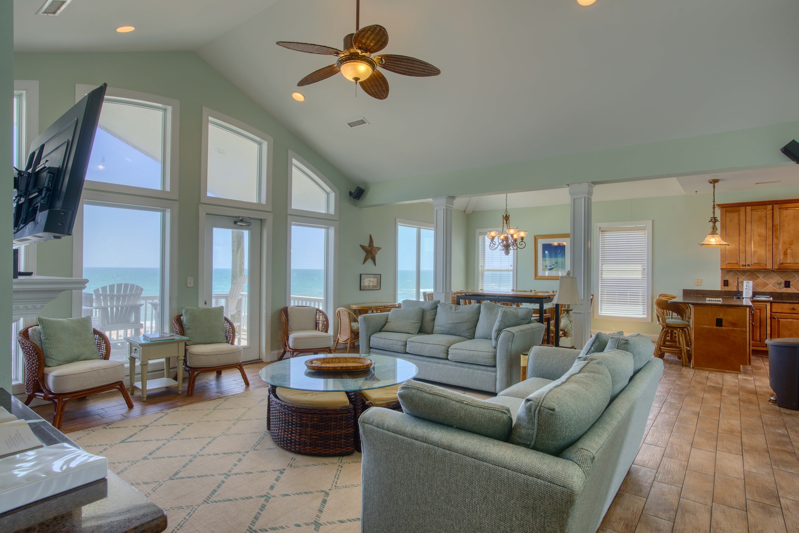Settle into your coastal retreat with ocean views framing every moment. The open living area welcomes you with breezy comfort, vaulted ceilings, and seamless flow into the kitchen—perfect for gathering and relaxing.