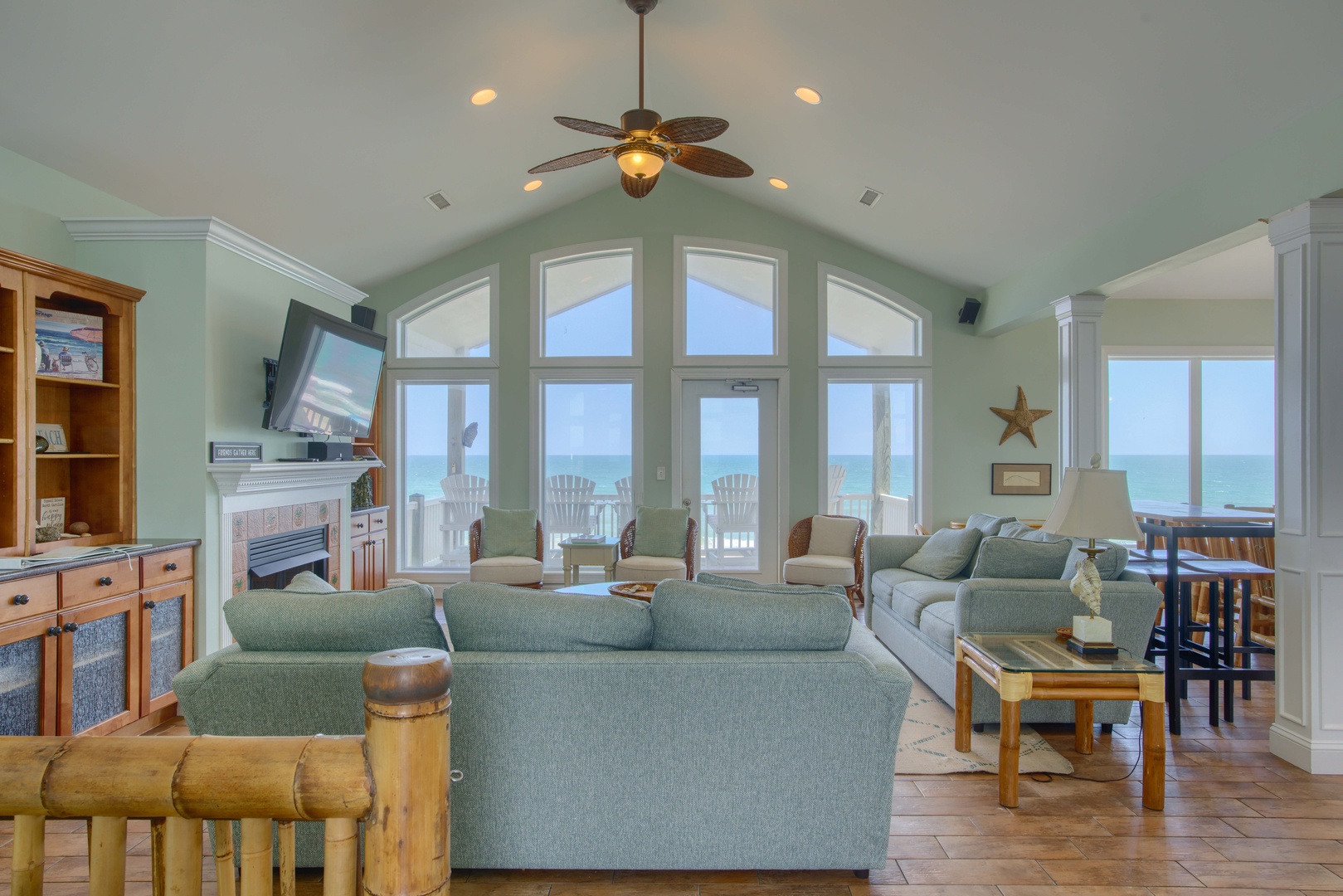 Your beachfront sanctuary with soaring ceilings and ocean views right from your living room. Sink into coastal-inspired comfort and feel the sea breeze through expansive windows that frame the horizon.