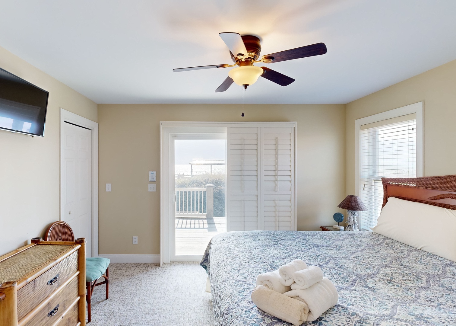 Wake up to soft coastal light filtering through your private balcony doors, where fresh towels await and ocean breezes invite you to start your day with a view.