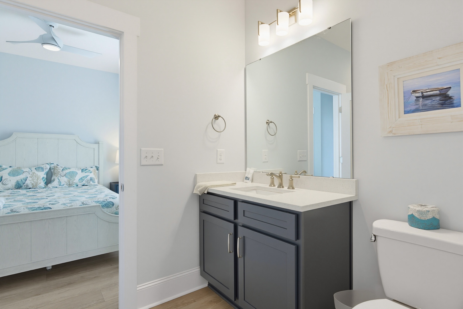 Step into your serene en-suite bathroom, where soft coastal tones and stylish fixtures create a refreshing retreat. The sleek vanity and bright lighting make morning routines feel effortless and calming.