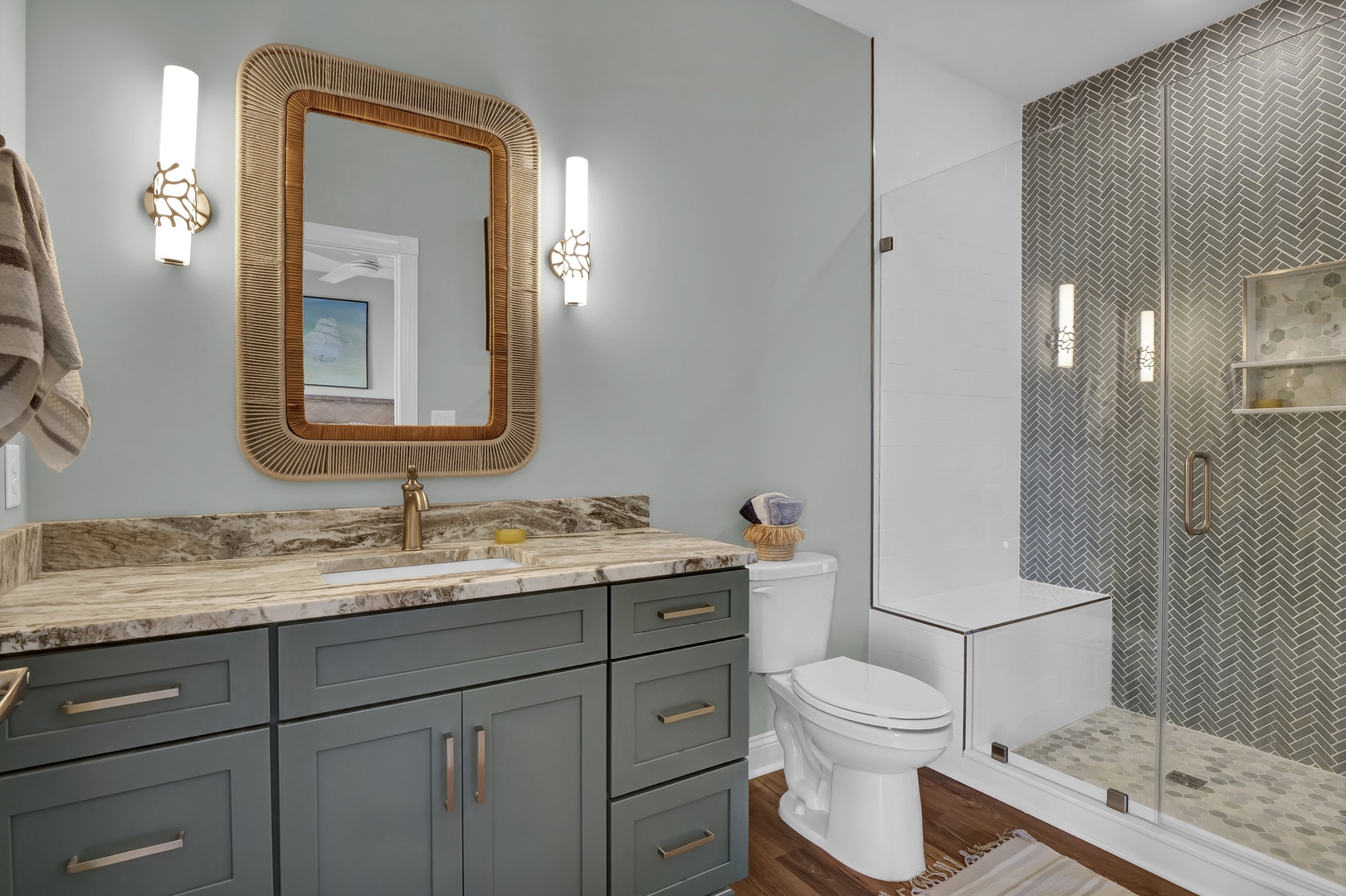 Step into your stylish bathroom sanctuary with elegant marble counters, designer fixtures, and a spa-inspired herringbone-tiled shower. Every detail invites relaxation.