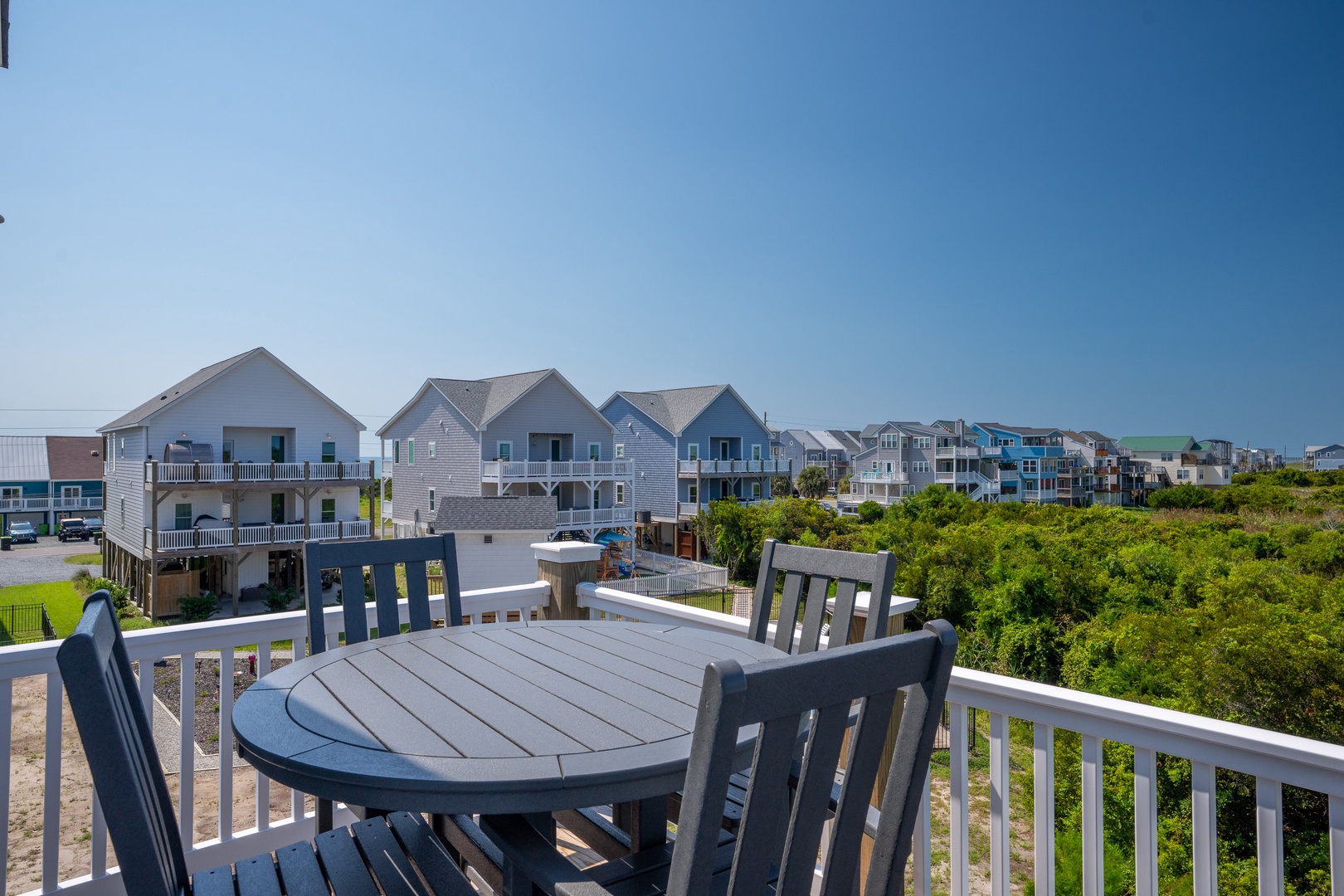 This coastal neighborhood provides easy access to beach activities and local amenities, with various nearby vacation homes creating a welcoming community atmosphere.