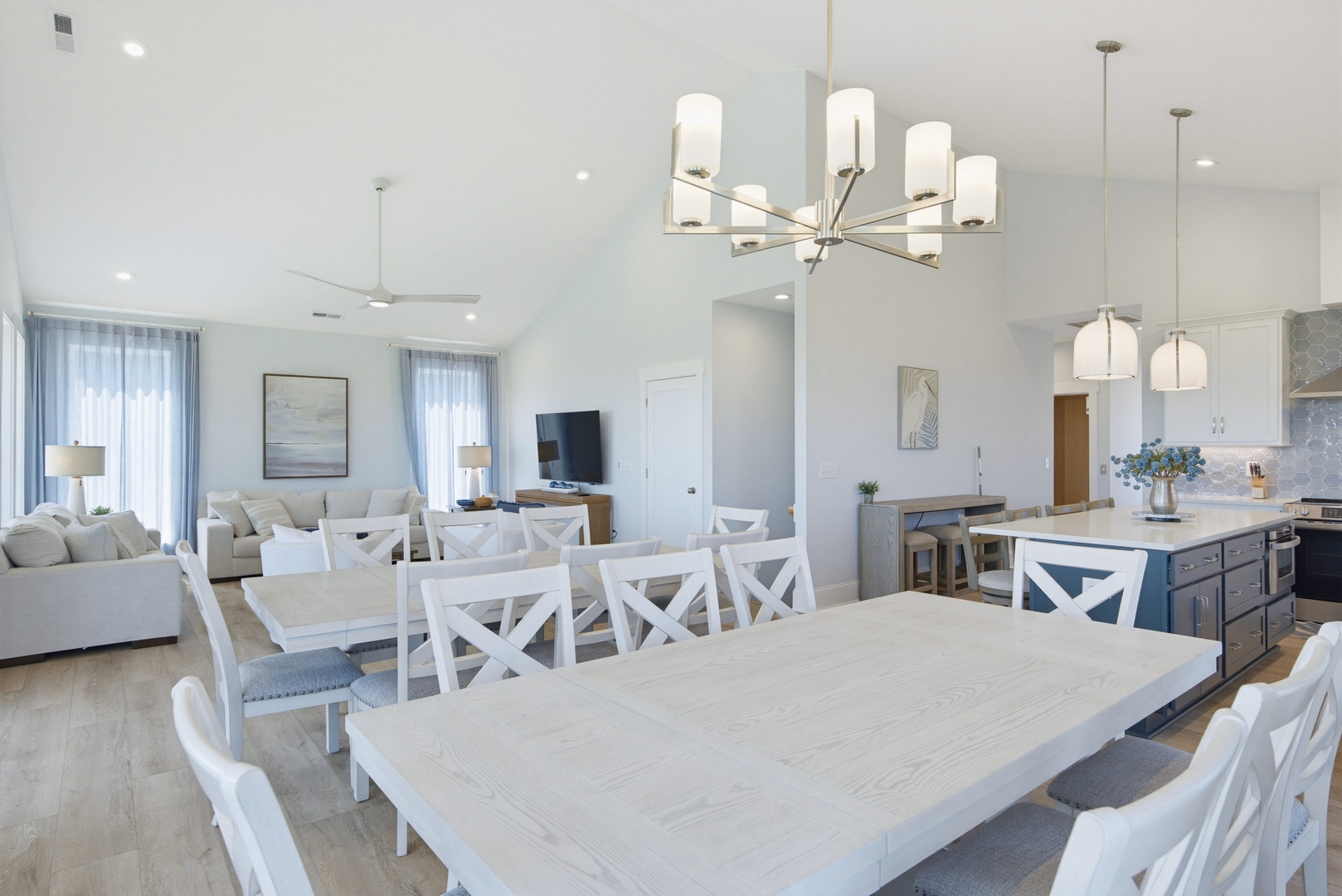 Gather around this beautiful dining table with seating for everyone, opening into a bright living room and fully-equipped kitchen—perfect for meals and memories together.