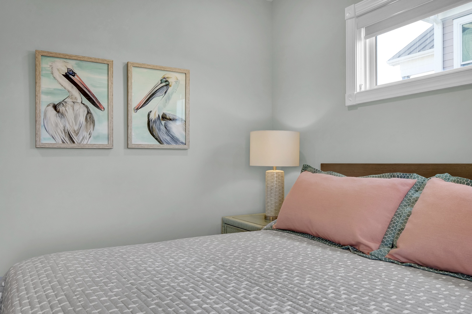 Your peaceful bedroom features coastal charm with soft linens and gentle natural light, creating a serene space for restful nights.
