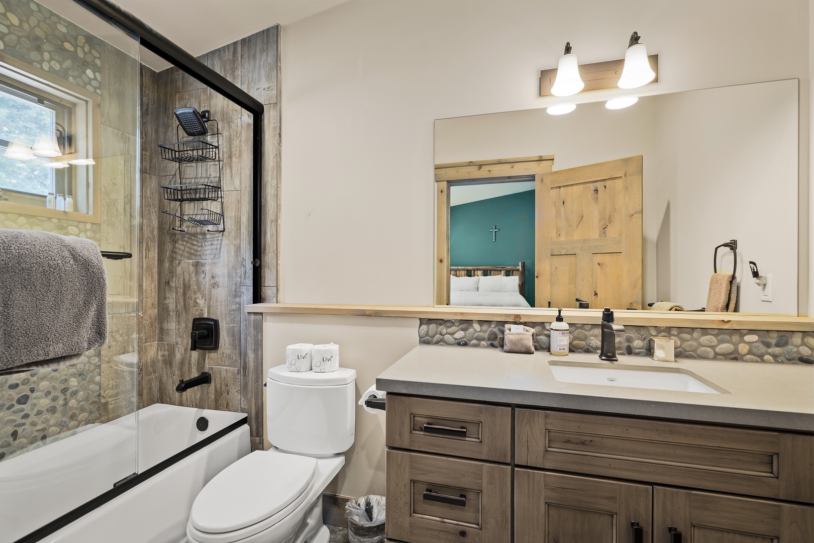 spacious ensuite with a four-piece ensuite, tub and shower combo, and large vanity