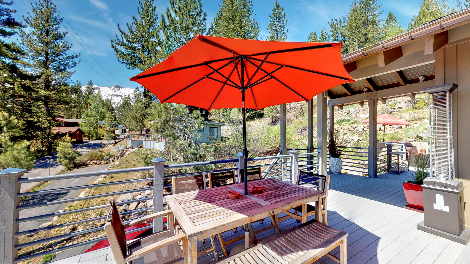 Outdoor seating with umbrella at this squaw valley rental: Eagle's Nest Lodge