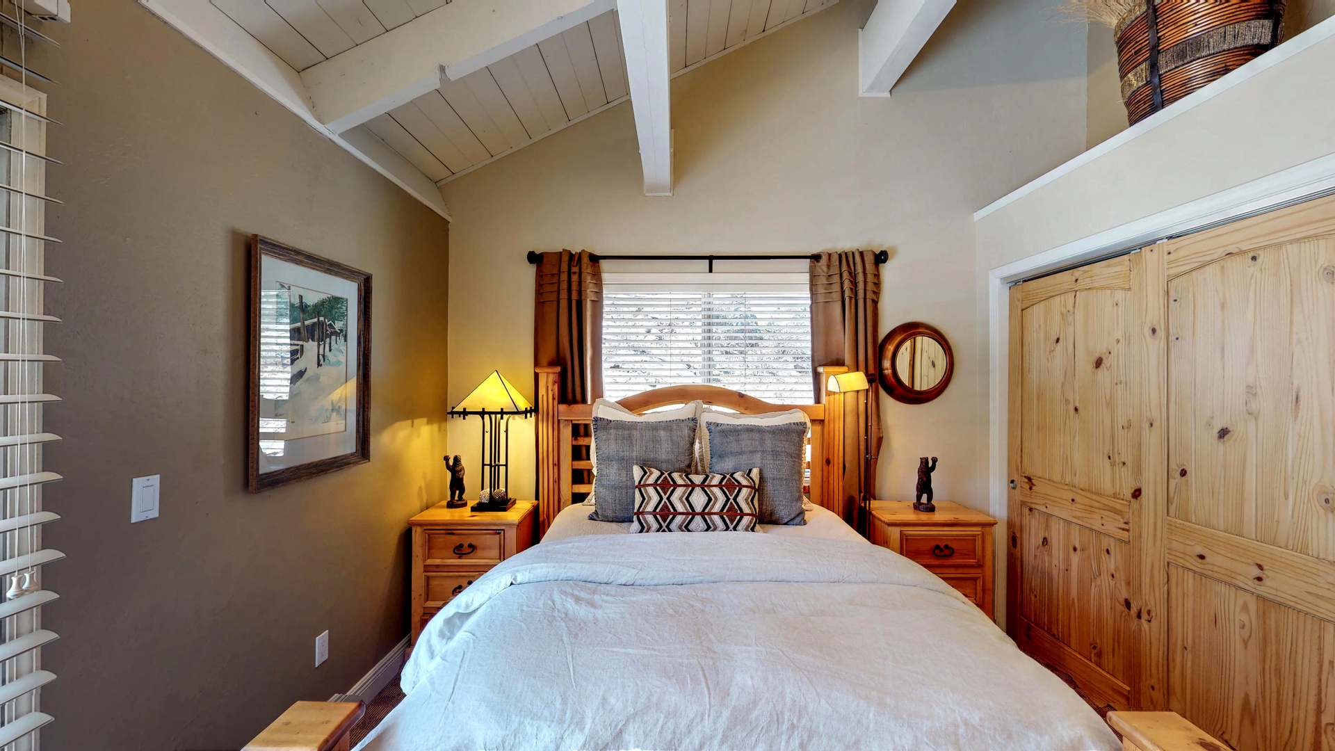 Bedroom with nearby closet and two nightstands: Eagle's Nest Lodge