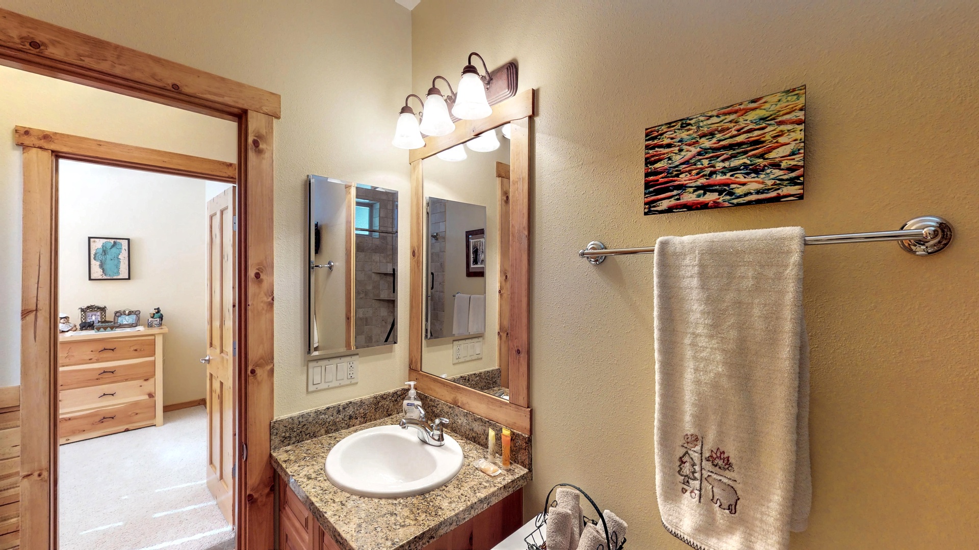 Bathroom with tan walls and sink: Truckee Cinnabar Vacation Retreat