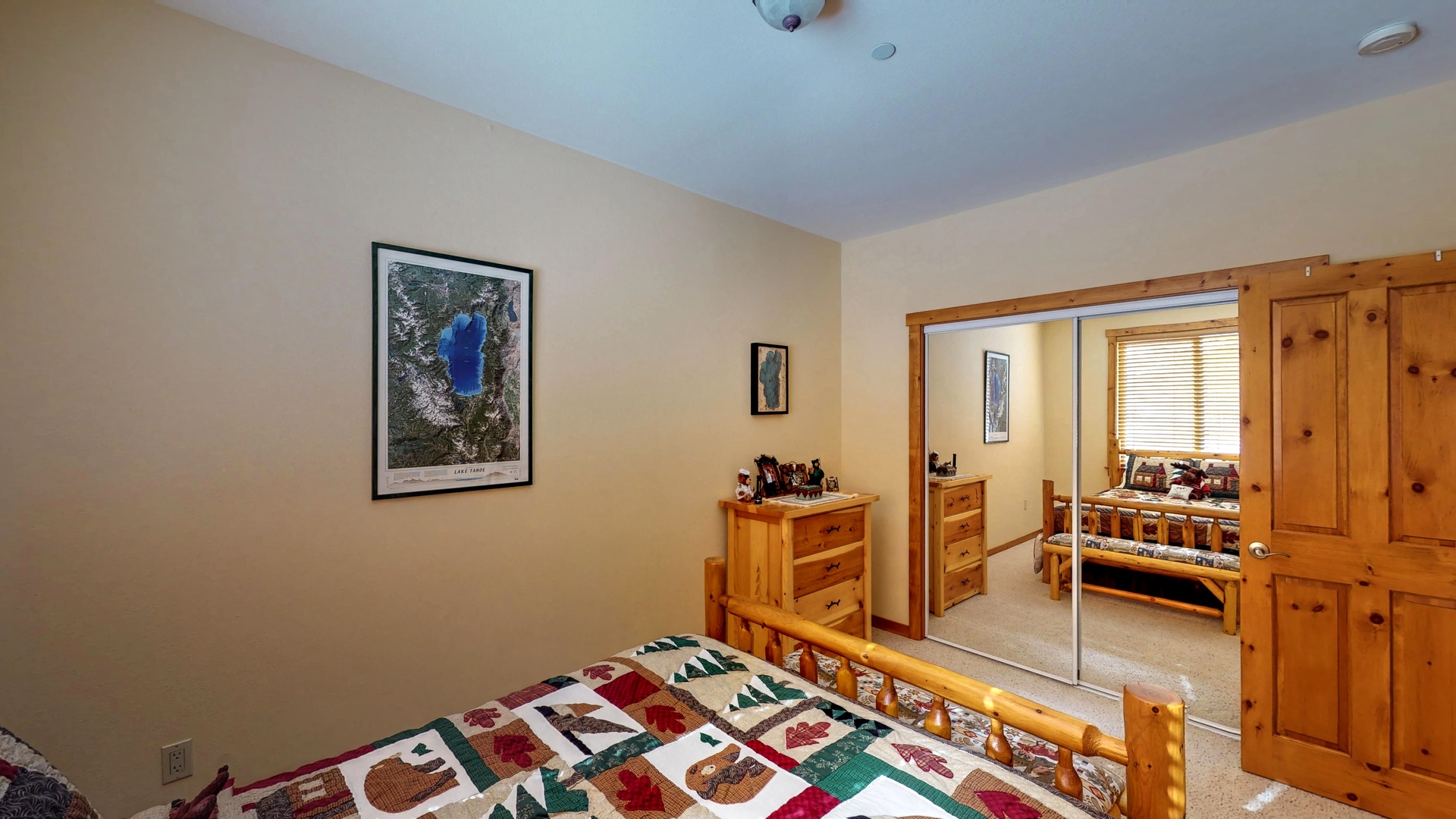 Bedroom with tan walls and closet: Truckee Cinnabar Vacation Retreat